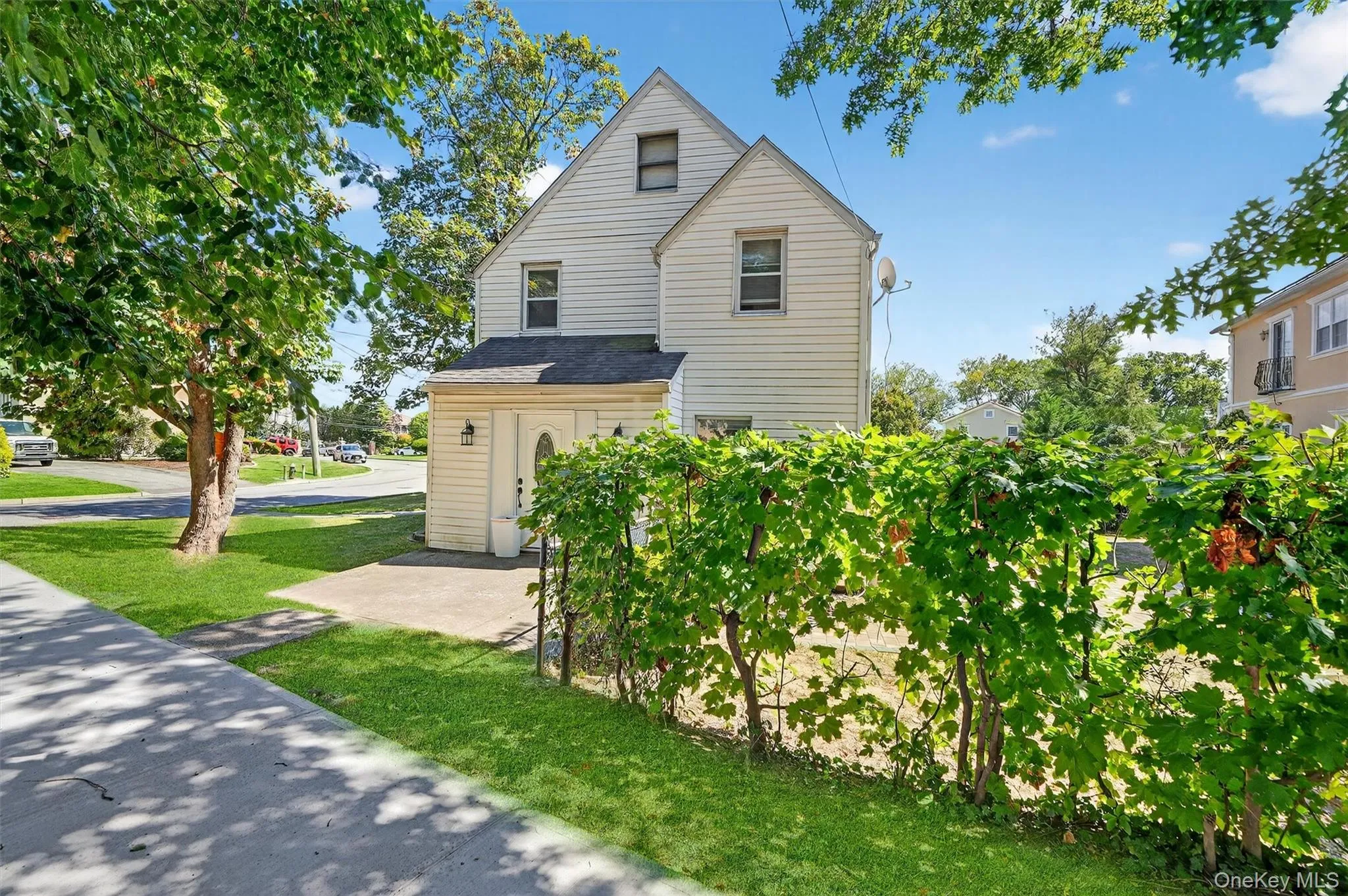 Traditional-style house featuring a front lawn Traditional-style house featuring a front lawn