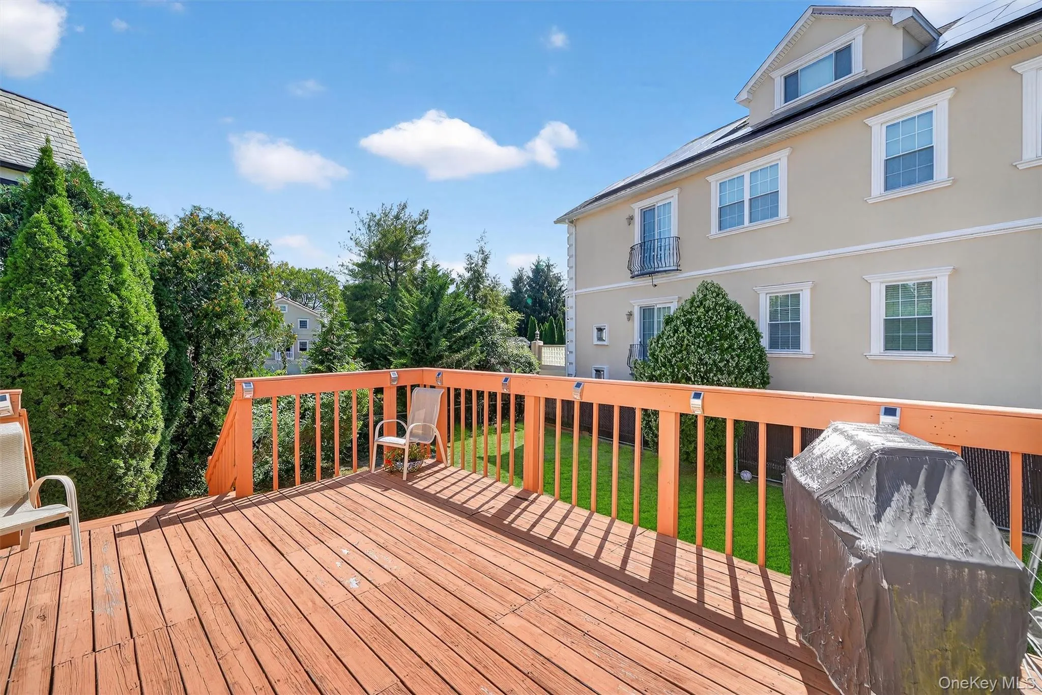 Deck featuring a lawn Deck featuring a lawn