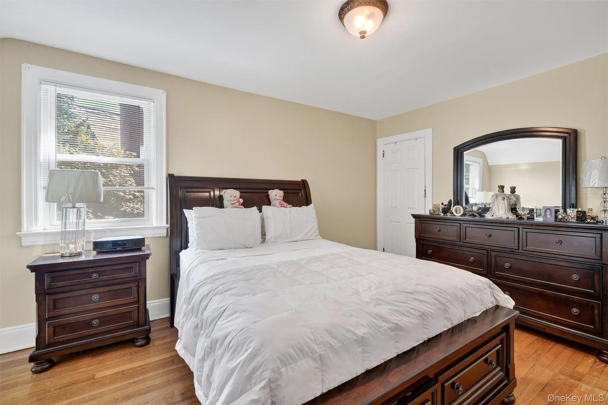 Bedroom featuring light wood finished floors Bedroom featuring light wood finished floors