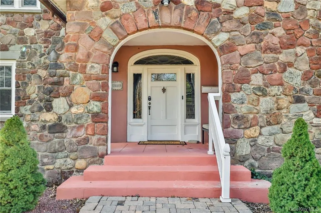 Property entrance with stone siding Property entrance with stone siding