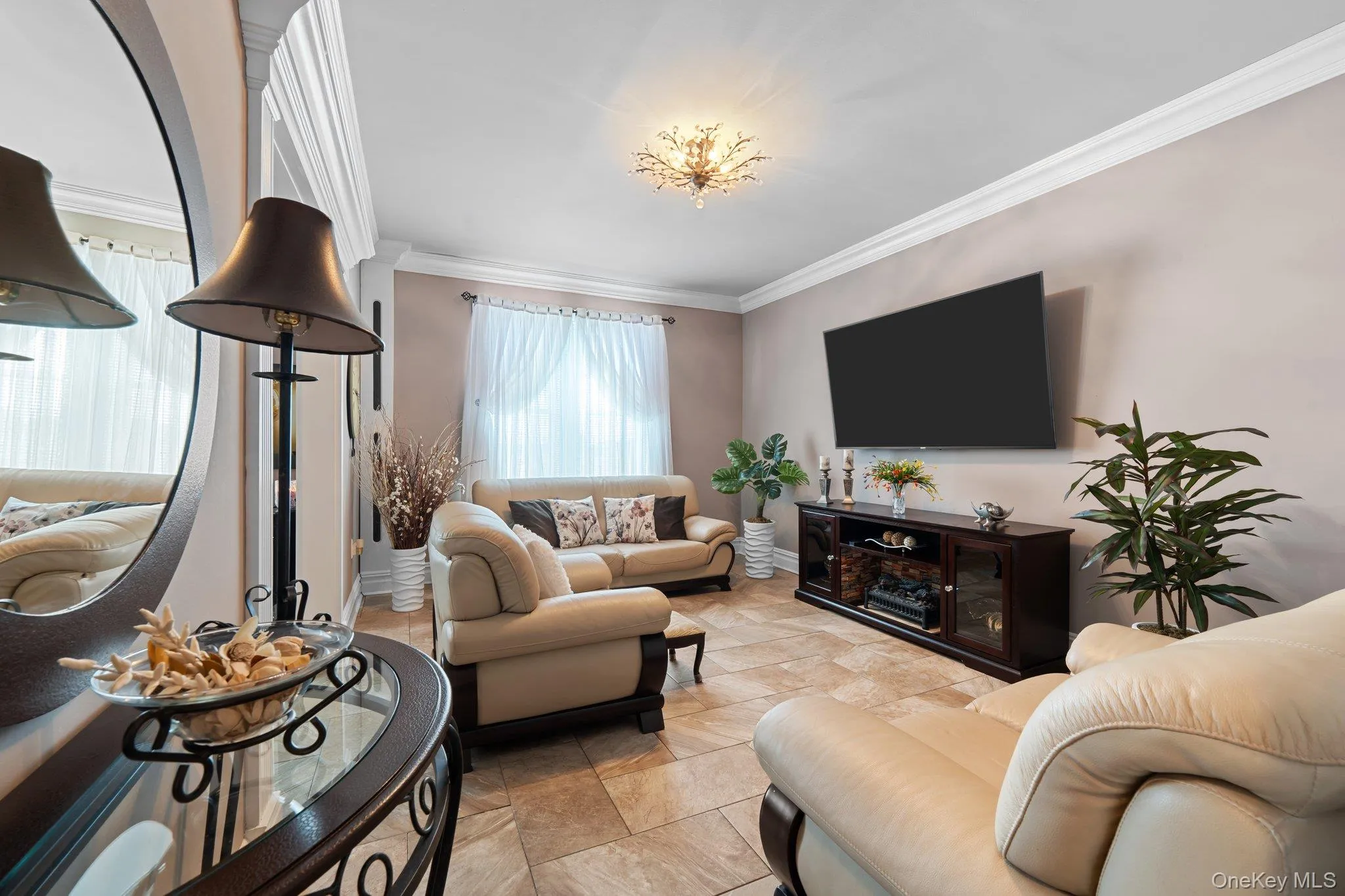 Currently set up as a Living area featuring crown molding Currently set up as a Living area featuring crown molding