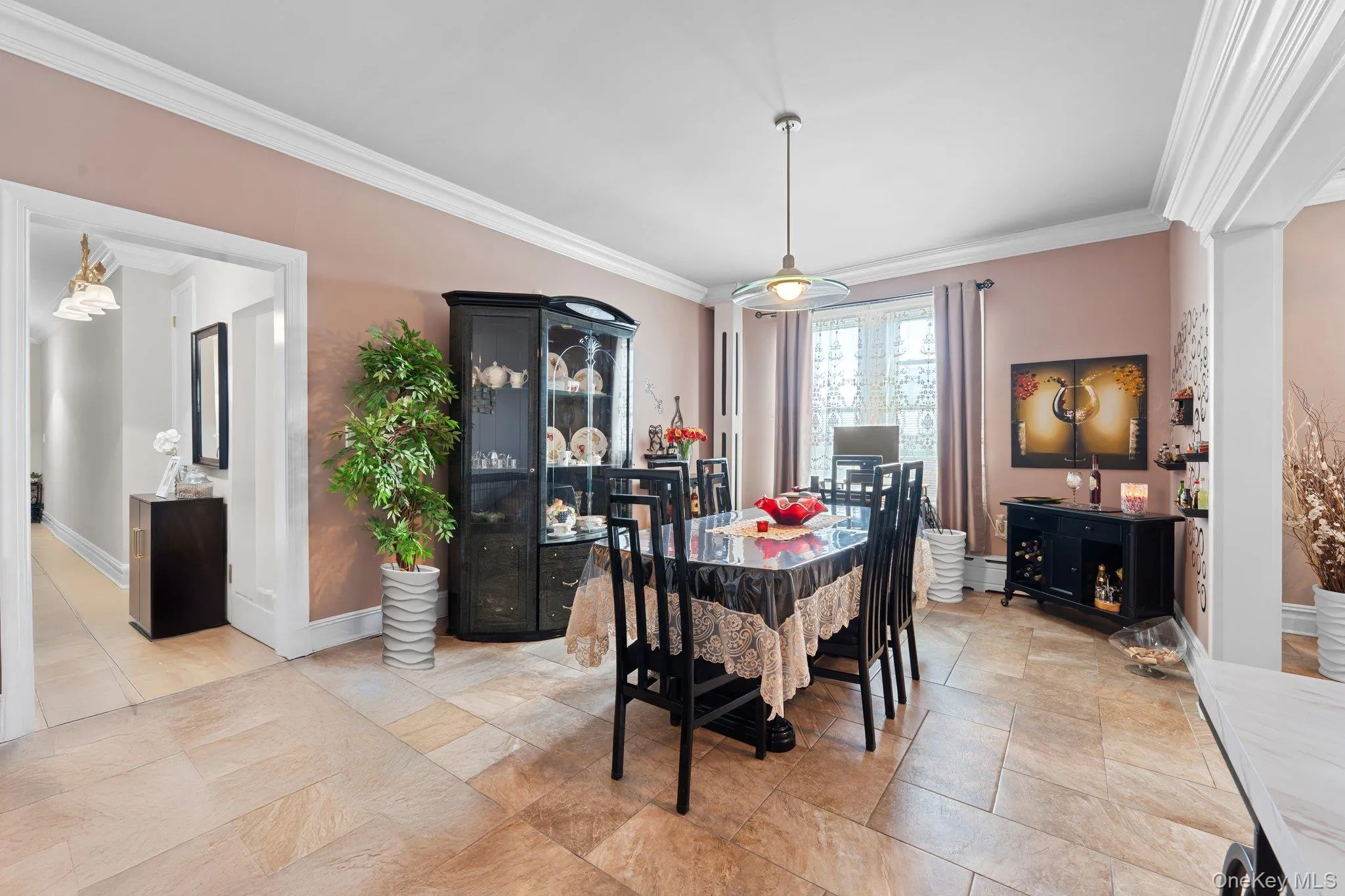 Dining space featuring crown molding and baseboard heating Dining space featuring crown molding and baseboard heating