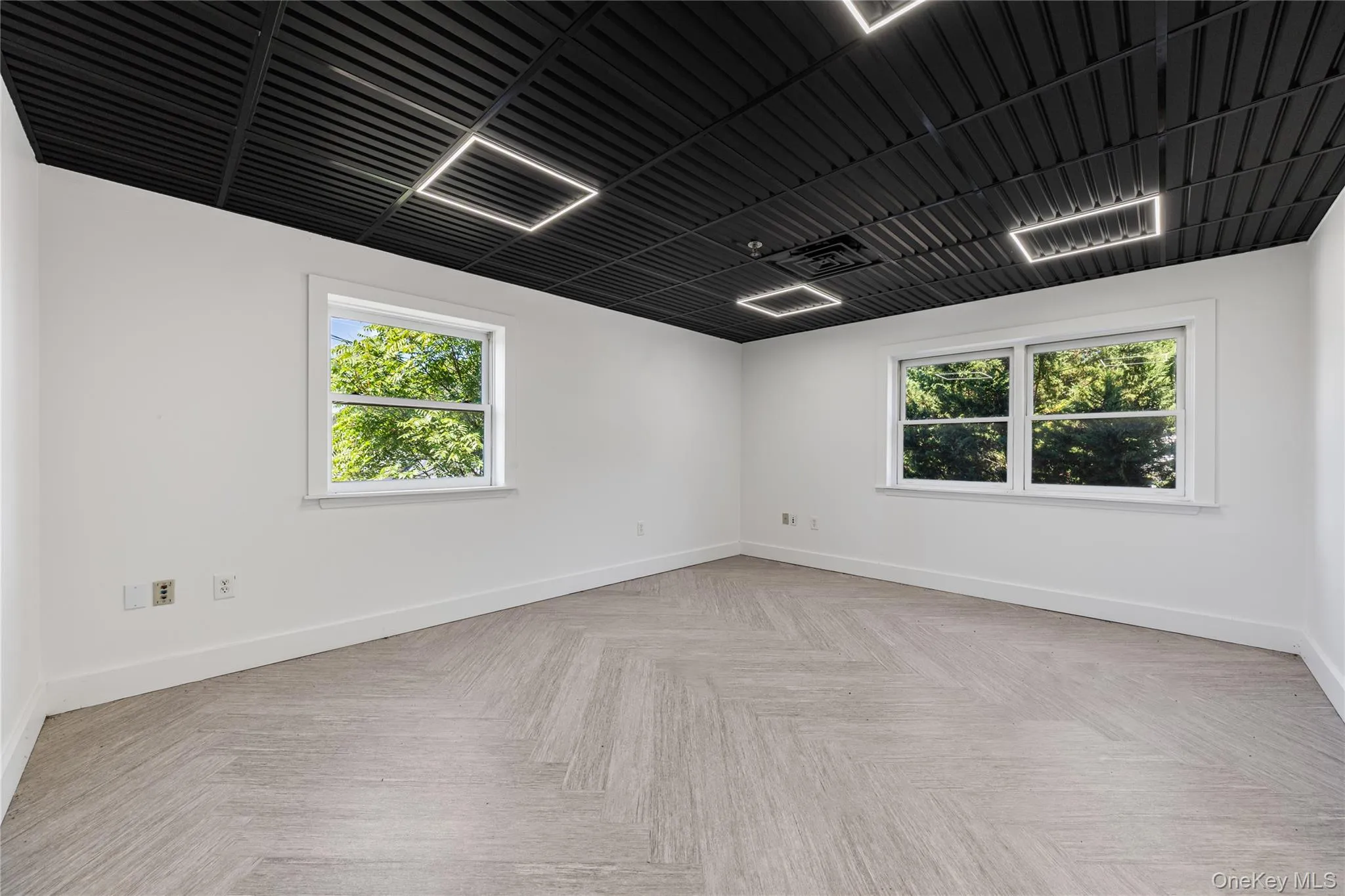 Spare room featuring plenty of natural light Spare room featuring plenty of natural light