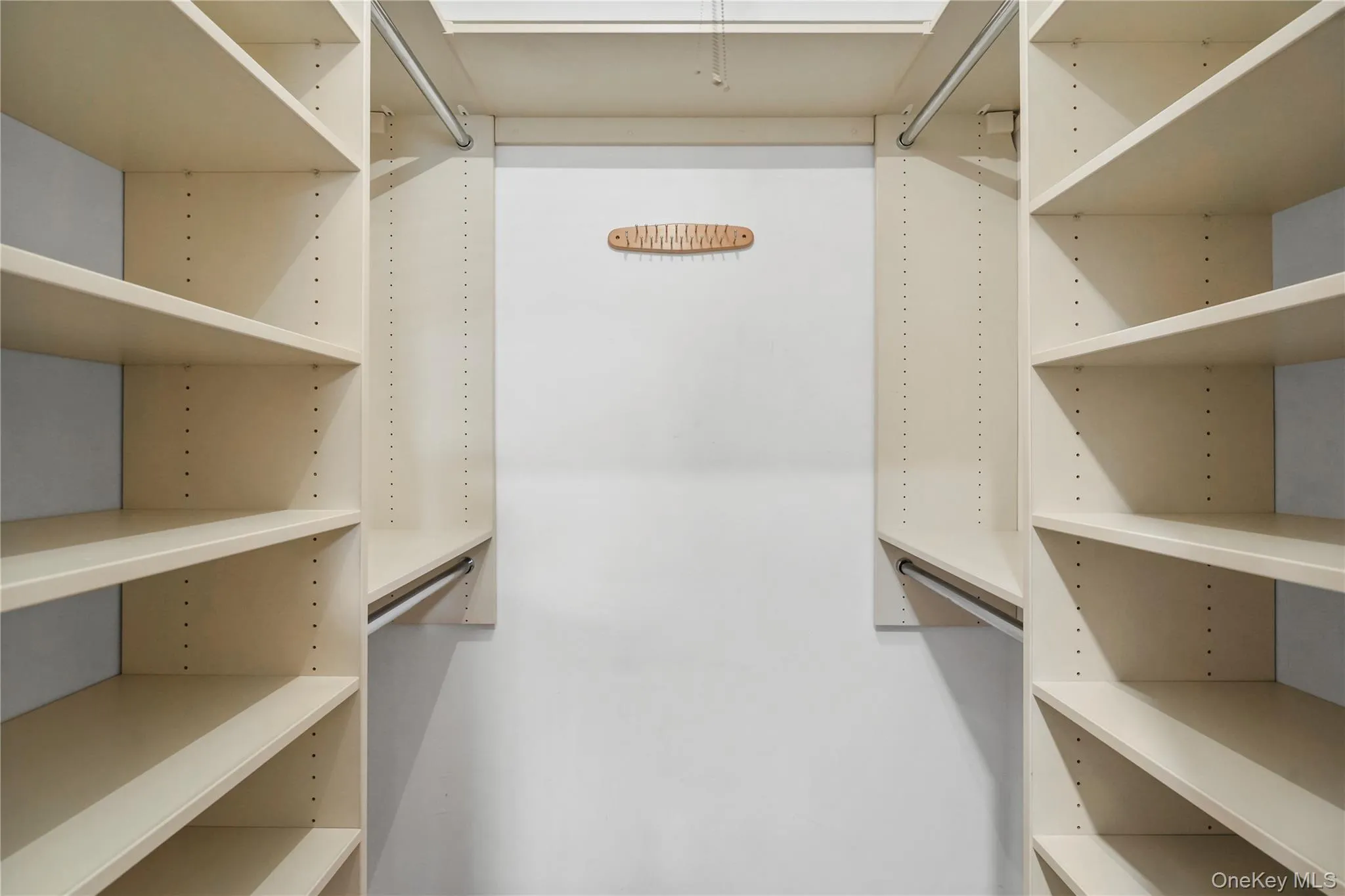 Primary suite walk-in closet. Primary suite walk-in closet.