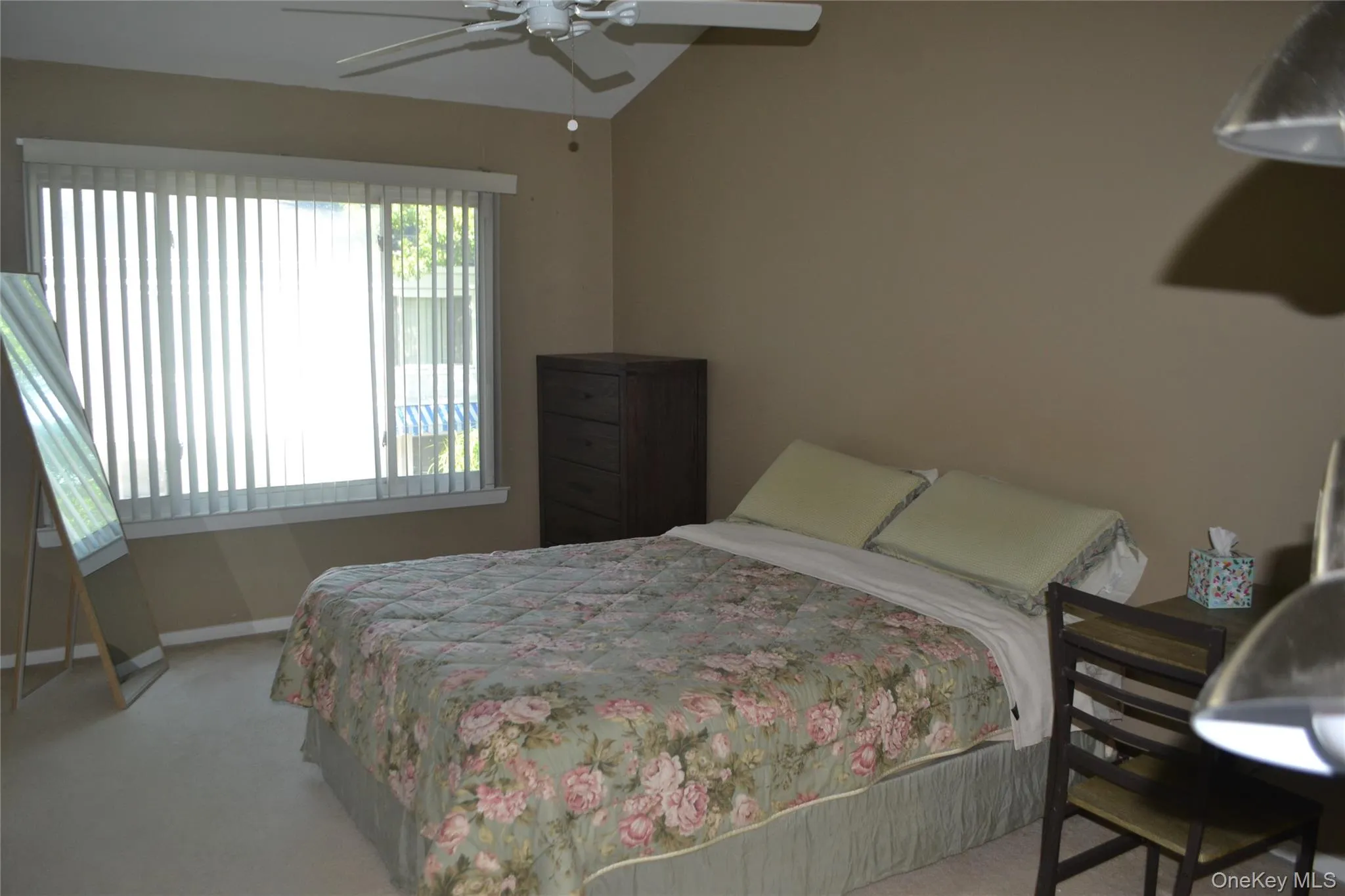 Bedroom featuring carpet floors and ceiling fan Bedroom featuring carpet floors and ceiling fan