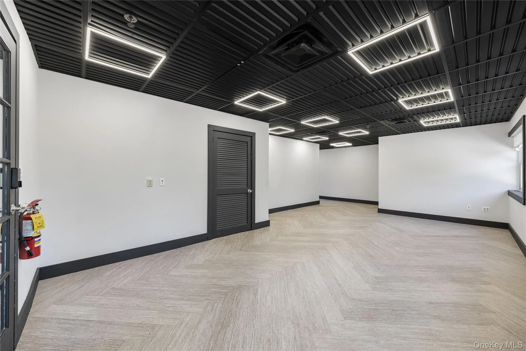 Unfurnished room with baseboards Unfurnished room with baseboards