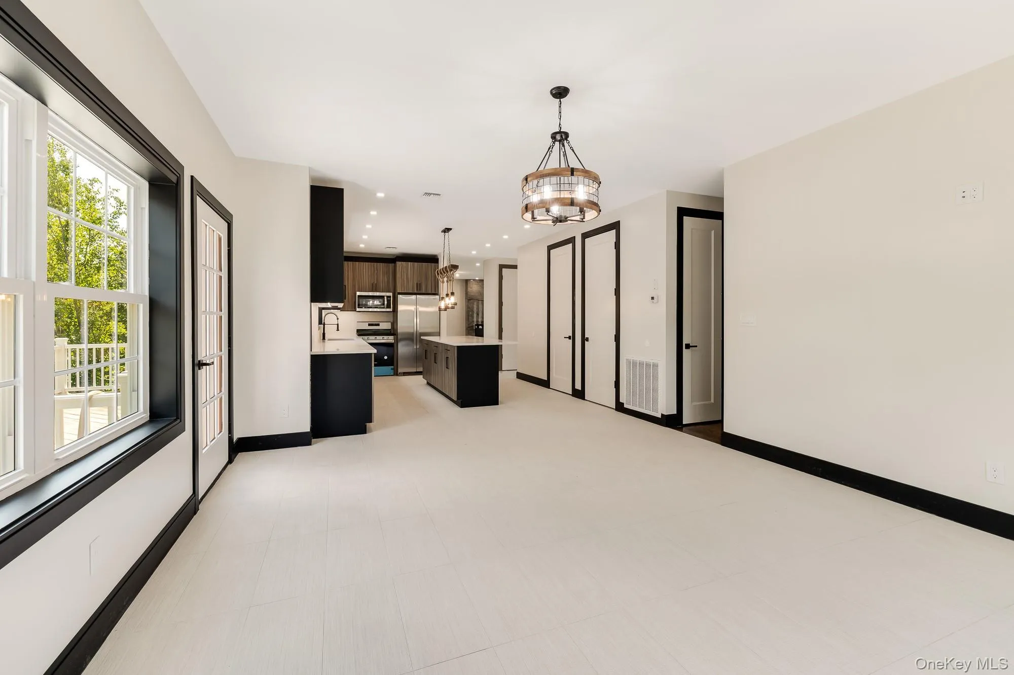 Kitchen with a chandelier, recessed lighting, visible vents, and a sink Kitchen with a chandelier, recessed lighting, visible vents, and a sink