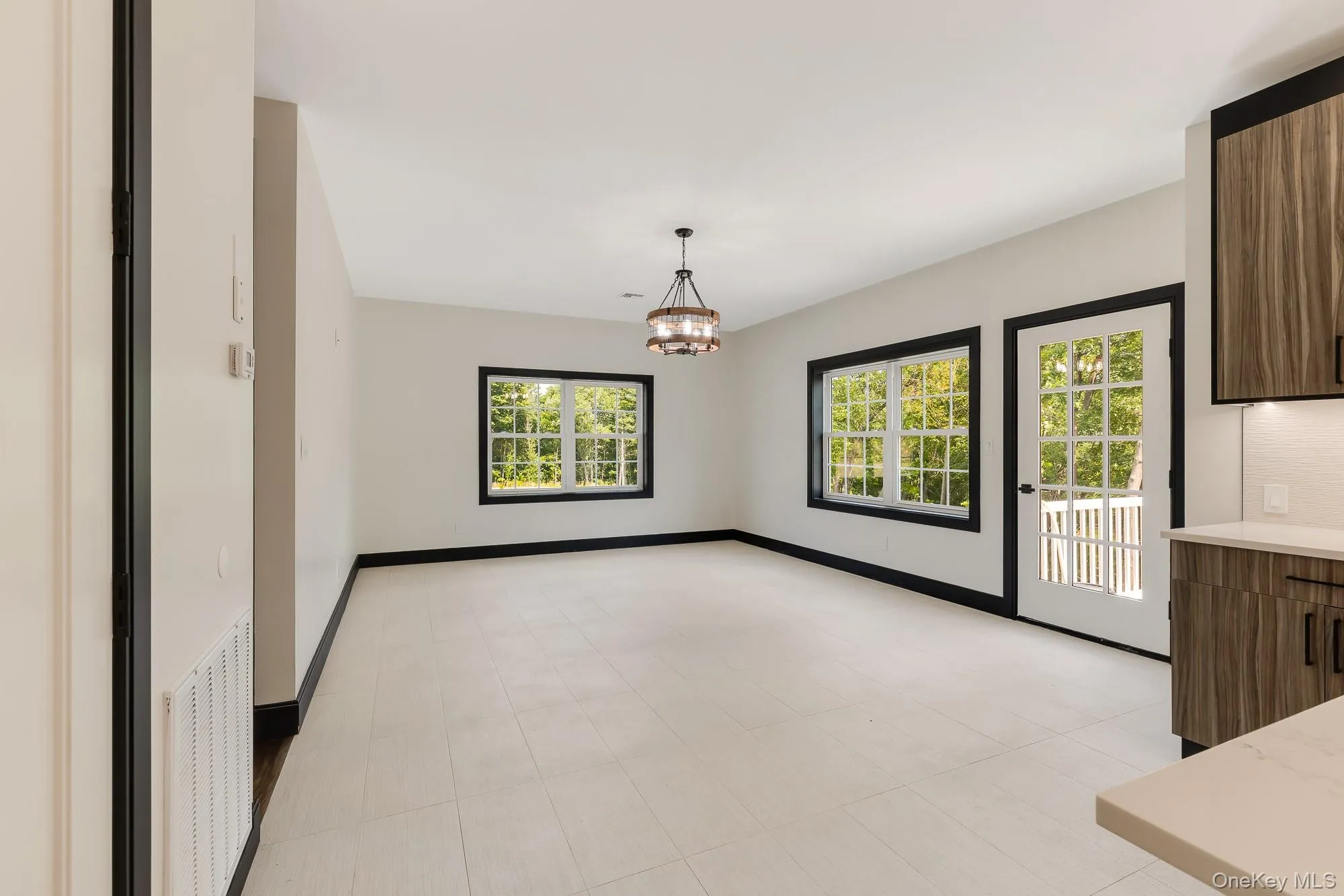 Unfurnished dining area with a chandelier. Unfurnished dining area with a chandelier.