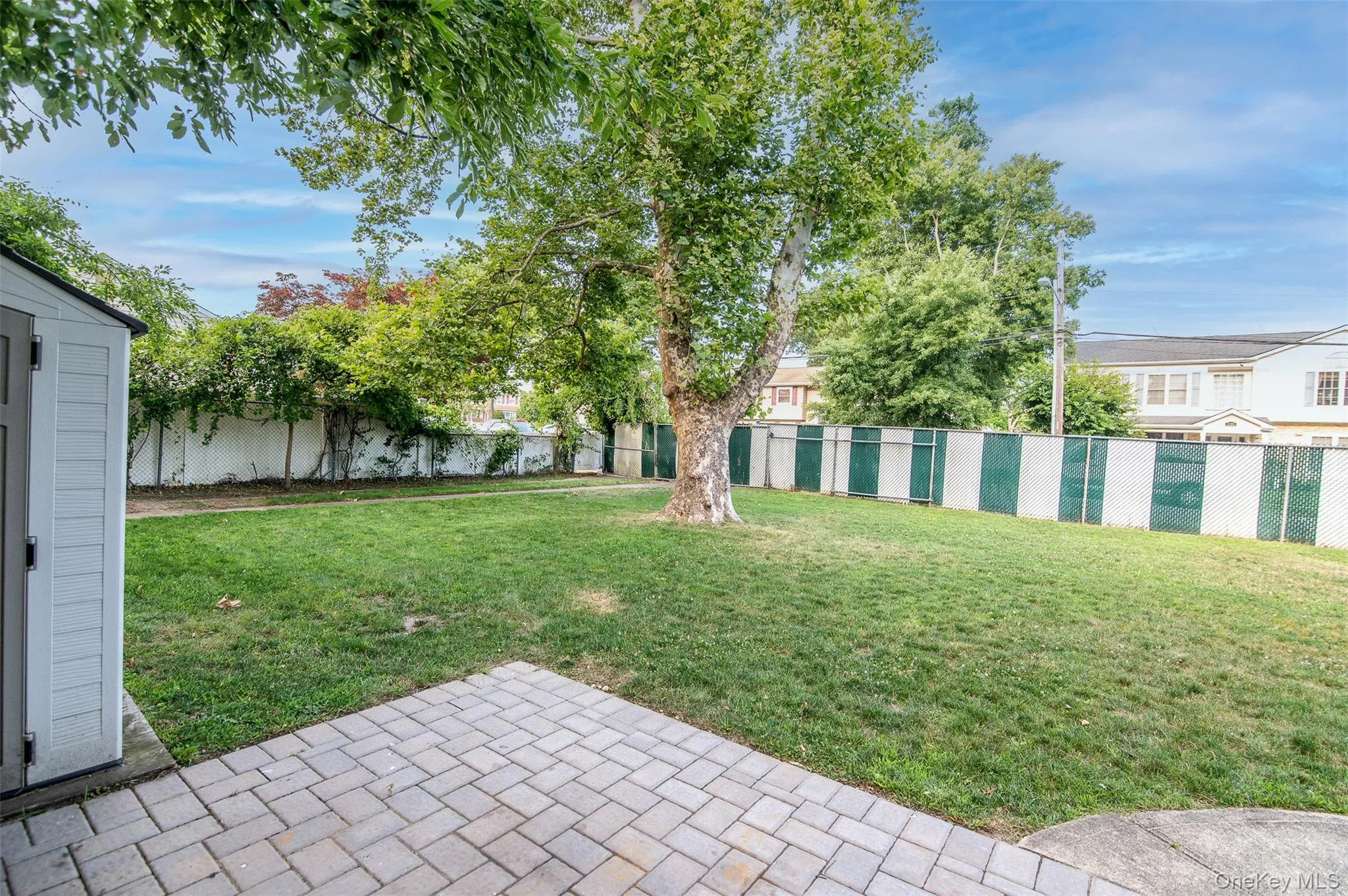 Fenced backyard featuring a patio area Fenced backyard featuring a patio area