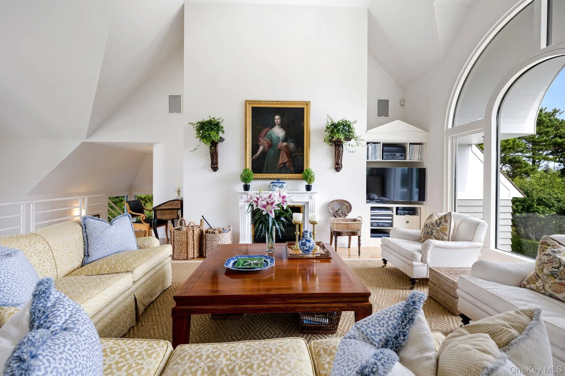 Living room featuring high vaulted ceiling Living room featuring high vaulted ceiling