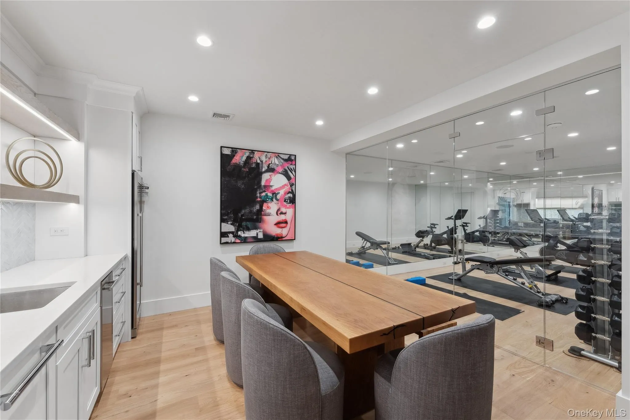 Dining space with recessed lighting and light wood-style flooring Dining space with recessed lighting and light wood-style flooring