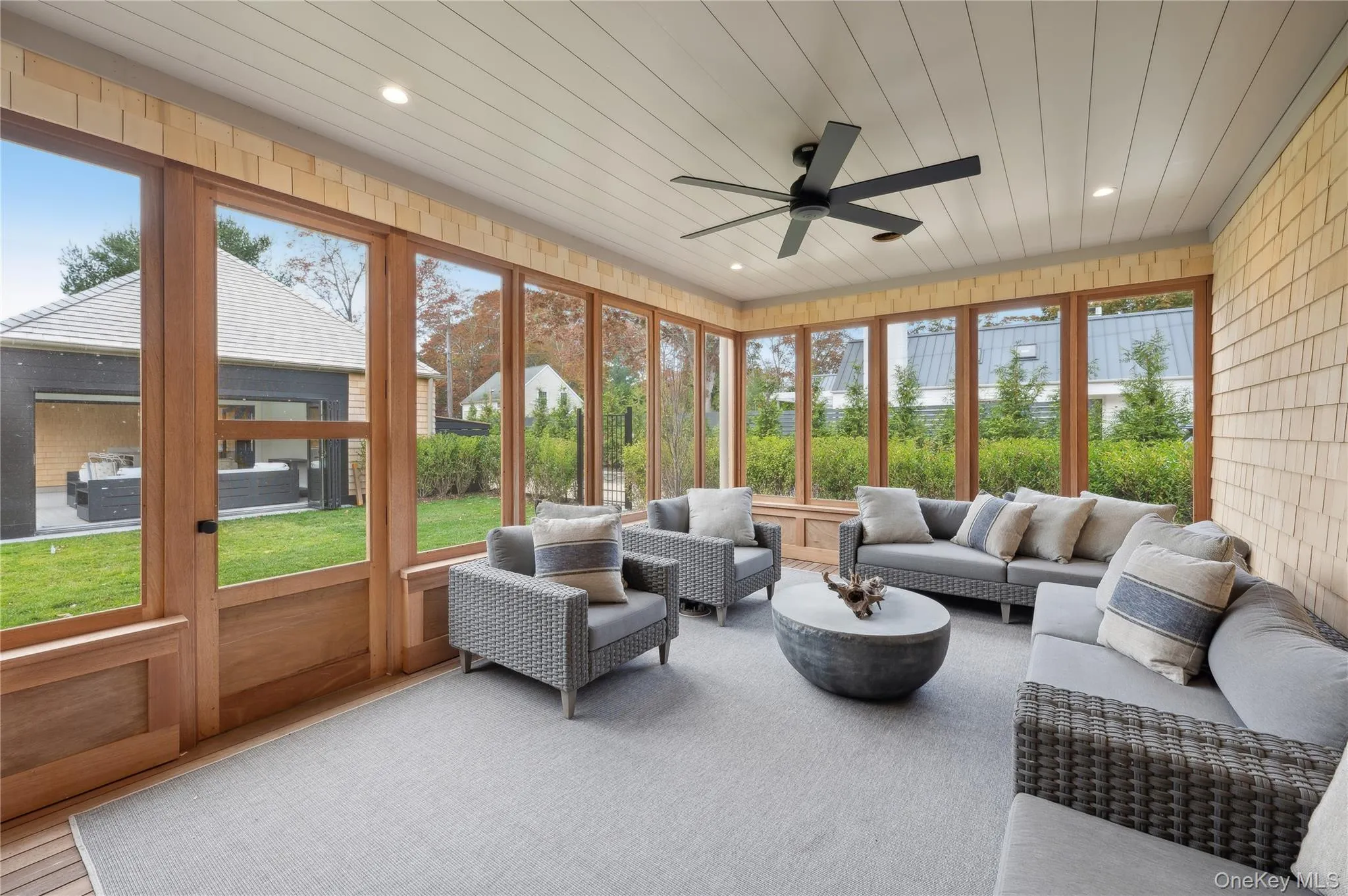 Sunroom / solarium with outdoor lounge area and ceiling fan Sunroom / solarium with outdoor lounge area and ceiling fan