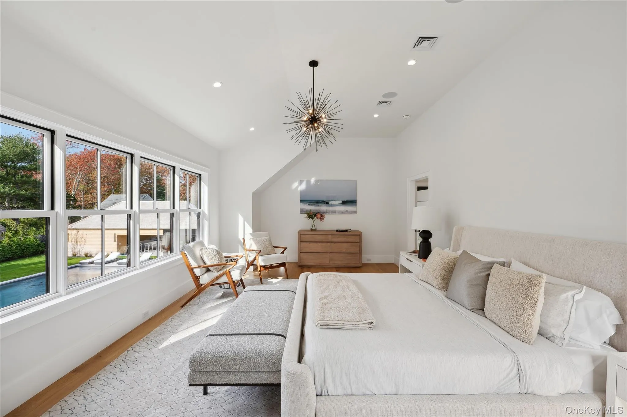 Bedroom with wood finished floors, recessed lighting, and lofted ceiling Bedroom with wood finished floors, recessed lighting, and lofted ceiling