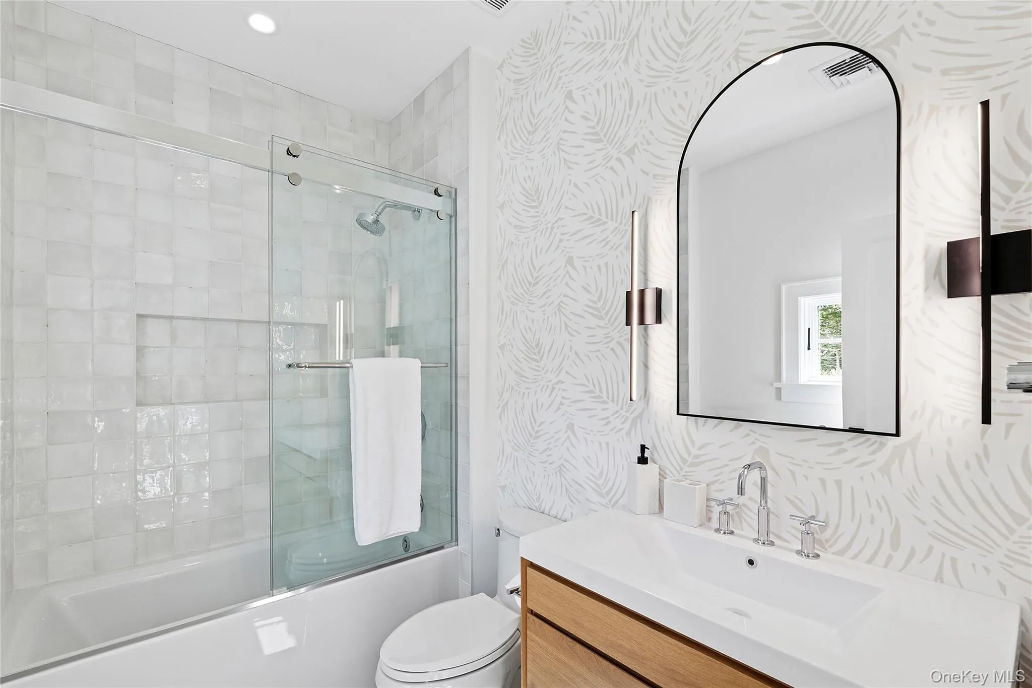 Full bath featuring enclosed tub / shower combo, vanity, and recessed lighting Full bath featuring enclosed tub / shower combo, vanity, and recessed lighting