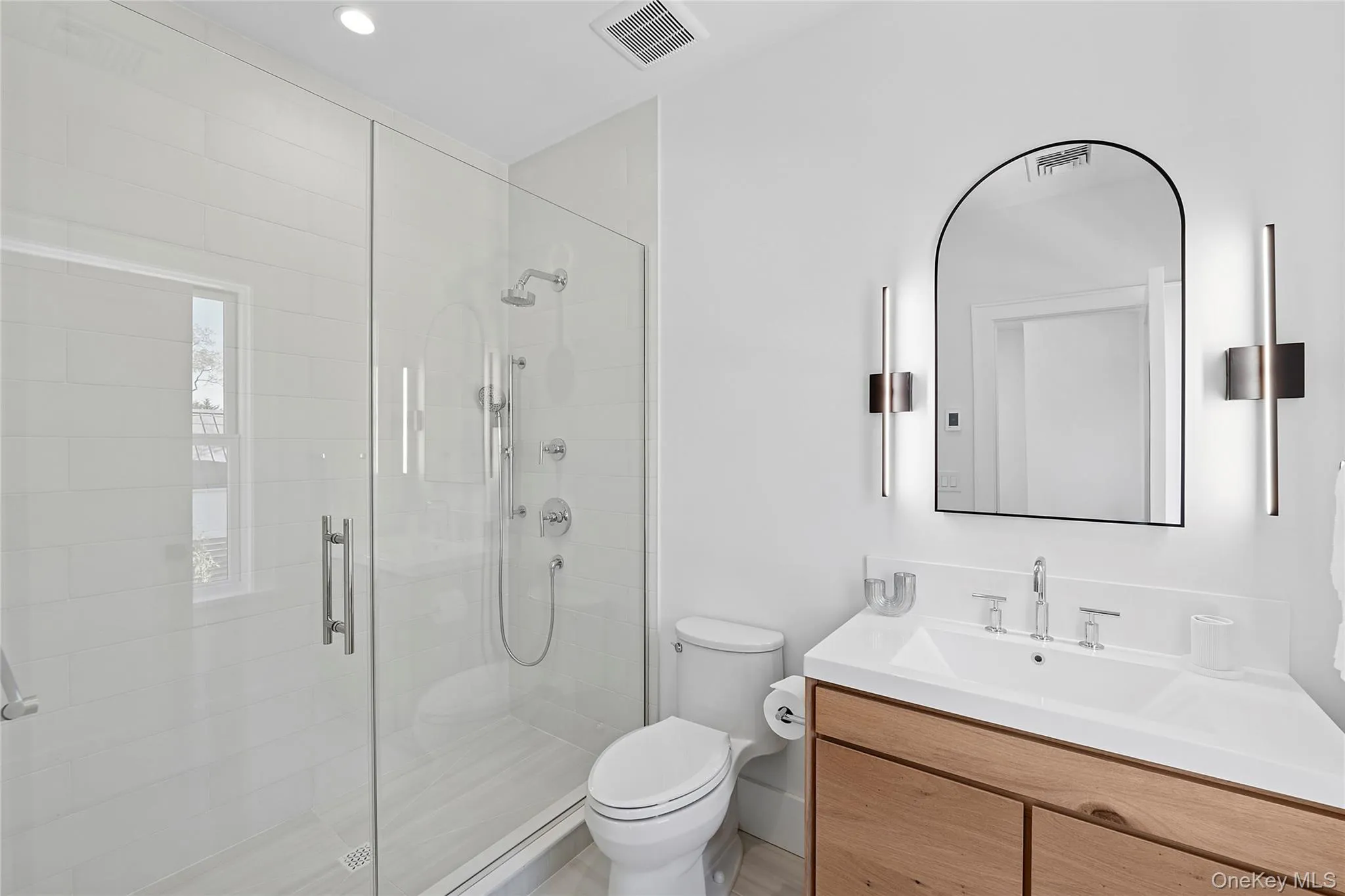 Full bathroom featuring vanity, a stall shower, and recessed lighting Full bathroom featuring vanity, a stall shower, and recessed lighting