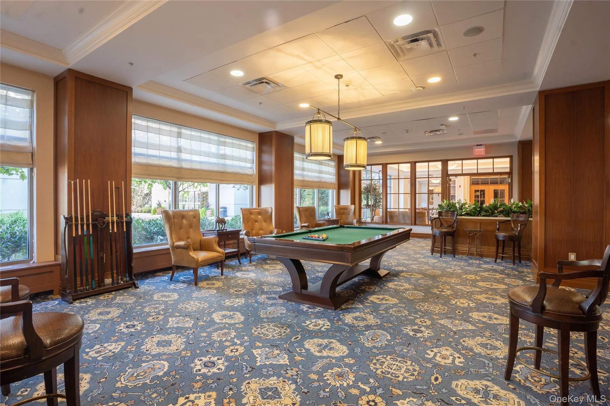 Billiard Room with a tray ceiling, pool table, ornamental molding, recessed lighting, and decorative carpet Billiard Room with a tray ceiling, pool table, ornamental molding, recessed lighting, and decorative carpet