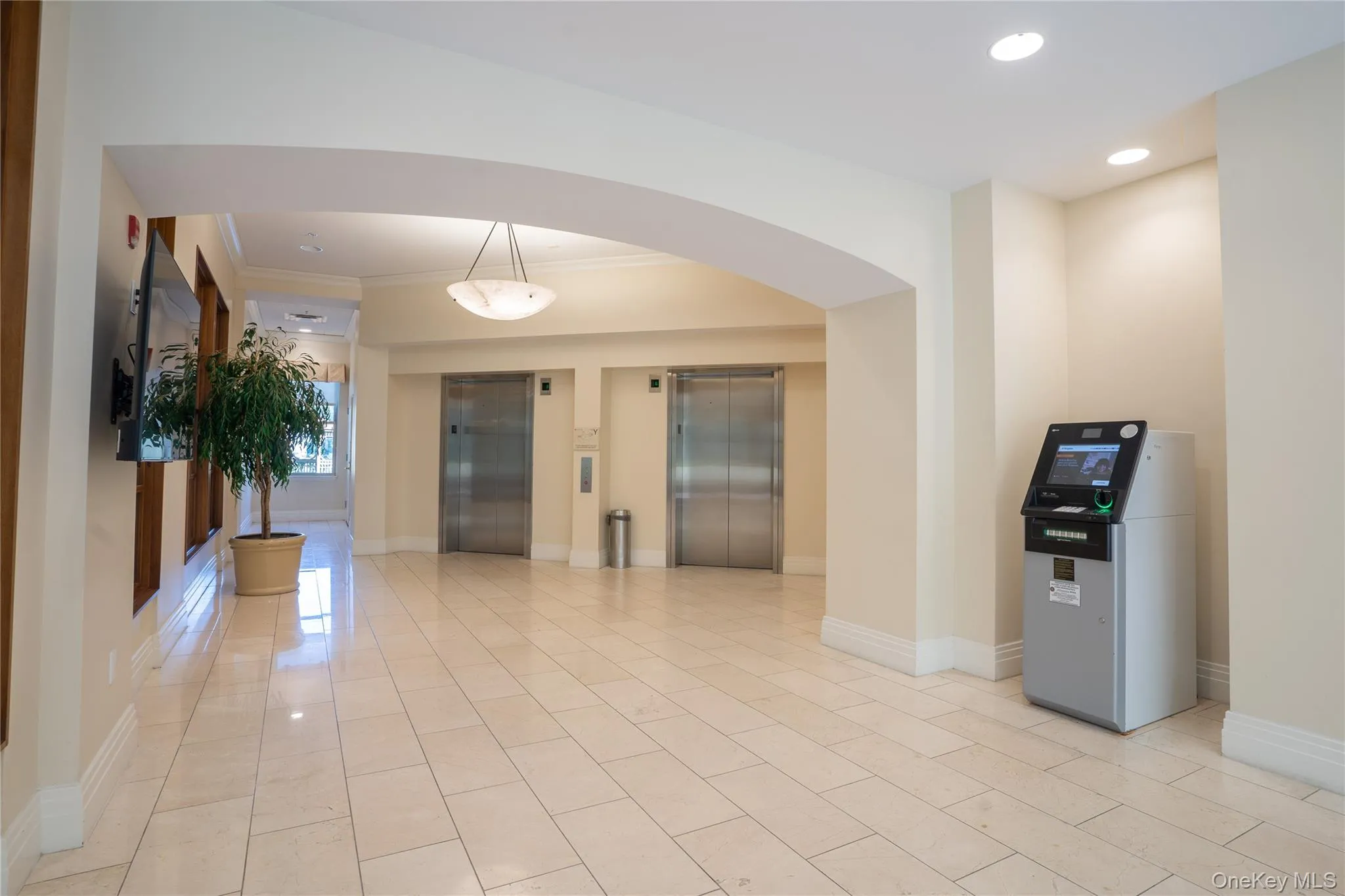 Elevator Lobby with ATM featuring recessed lighting and ornamental molding Elevator Lobby with ATM featuring recessed lighting and ornamental molding