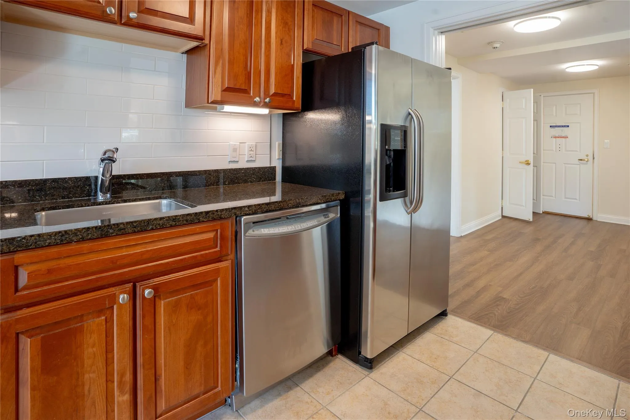 Kitchen showing stainless steel appliances and looking towards front entrance Kitchen showing stainless steel appliances and looking towards front entrance