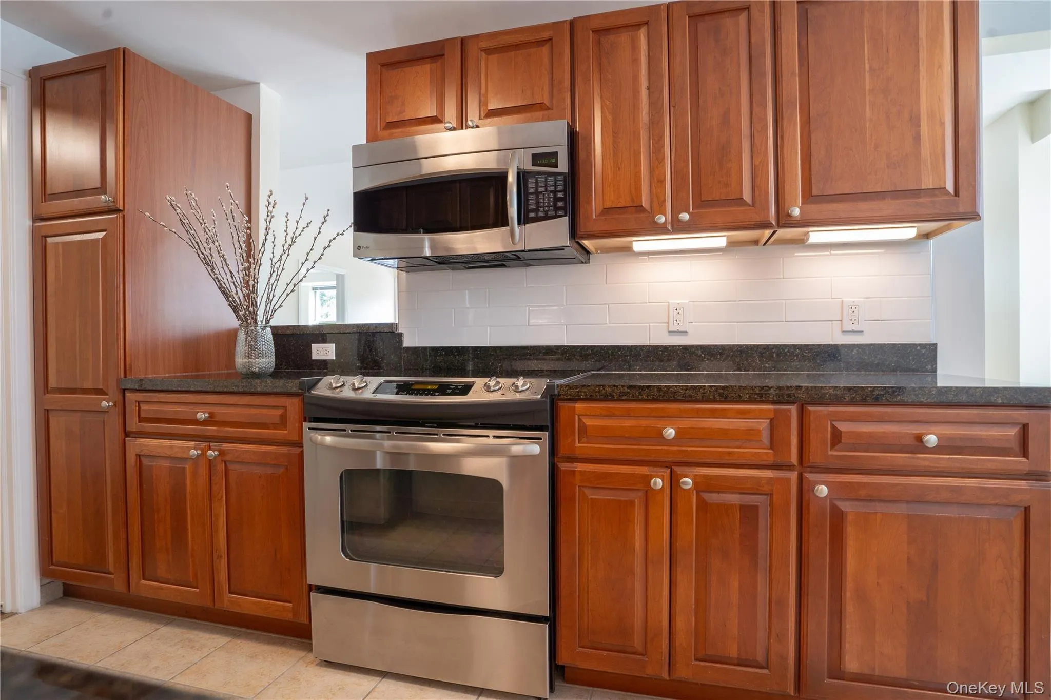 Kitchen showing window pass-through (where the plant is). Kitchen showing window pass-through (where the plant is).