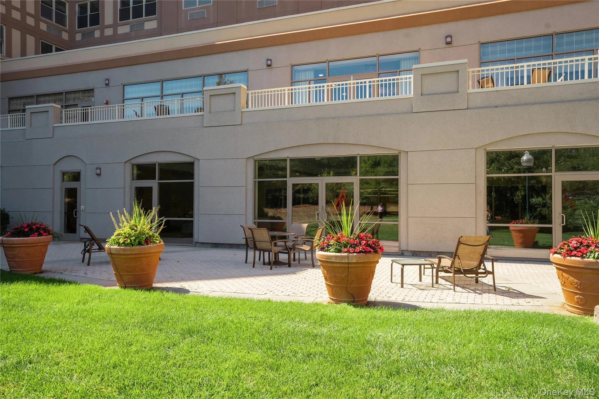 Rear view of property with stucco siding and patio area Rear view of property with stucco siding and patio area