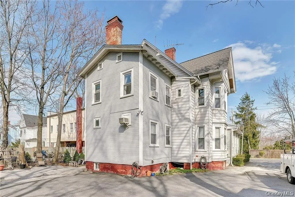 View of side of property with a chimney View of side of property with a chimney