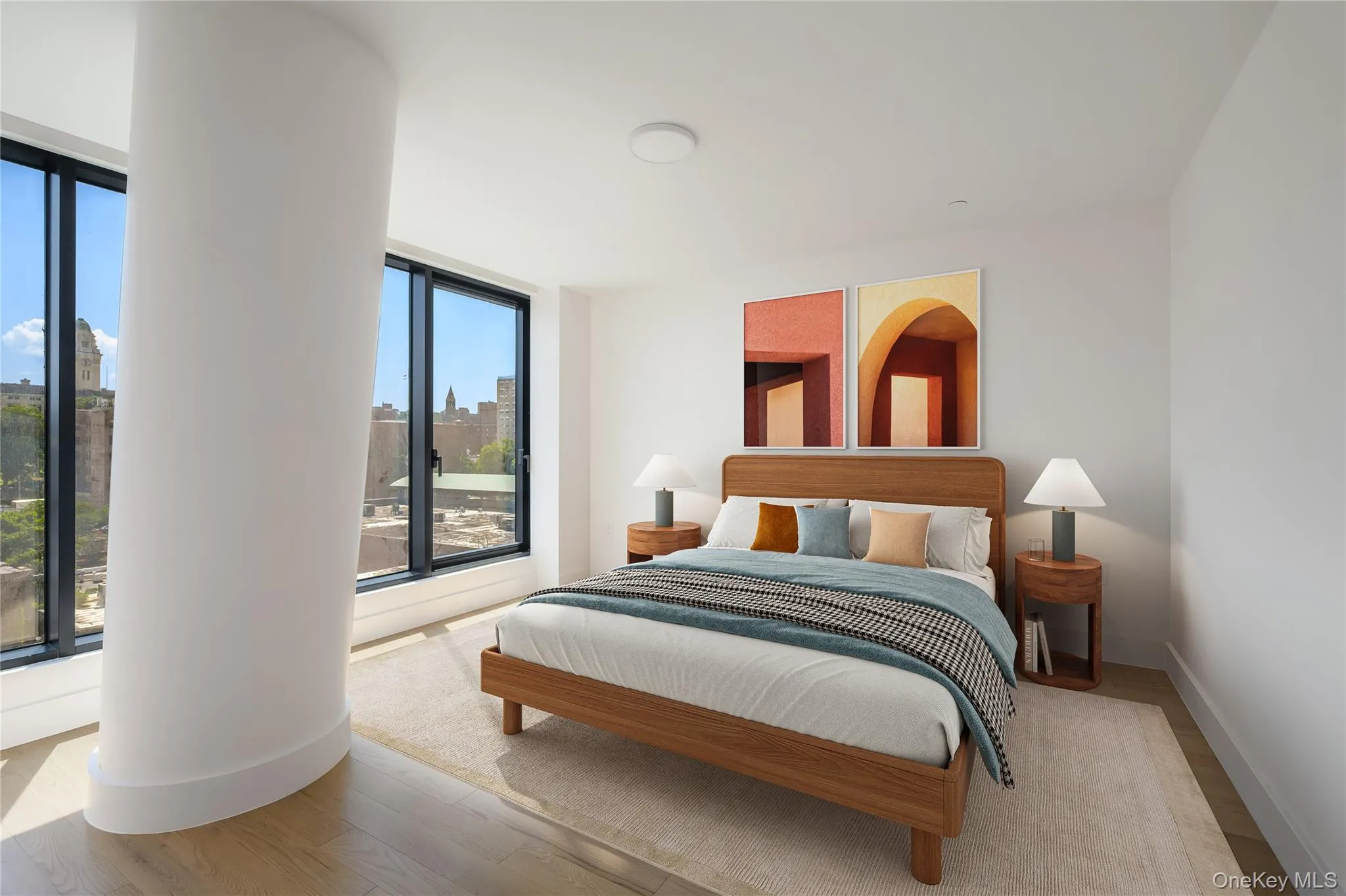 Bedroom with wood finished floors and a city view Bedroom with wood finished floors and a city view