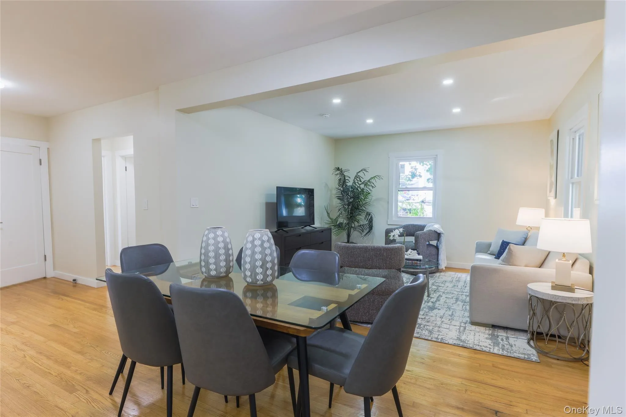 Dining space with light wood-style floors and recessed lighting Dining space with light wood-style floors and recessed lighting