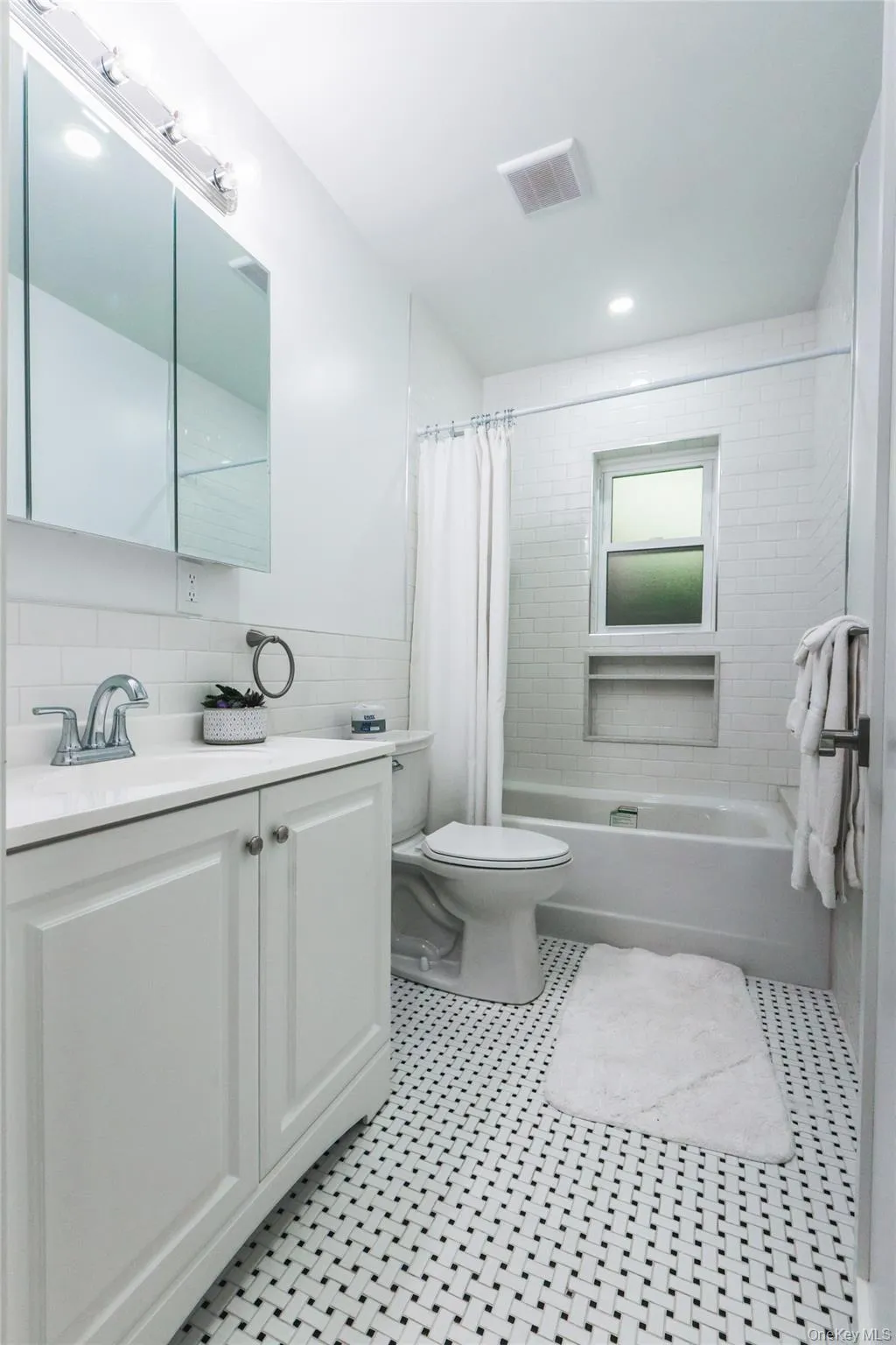 Full bath with vanity and shower / bath combination with curtain Full bath with vanity and shower / bath combination with curtain