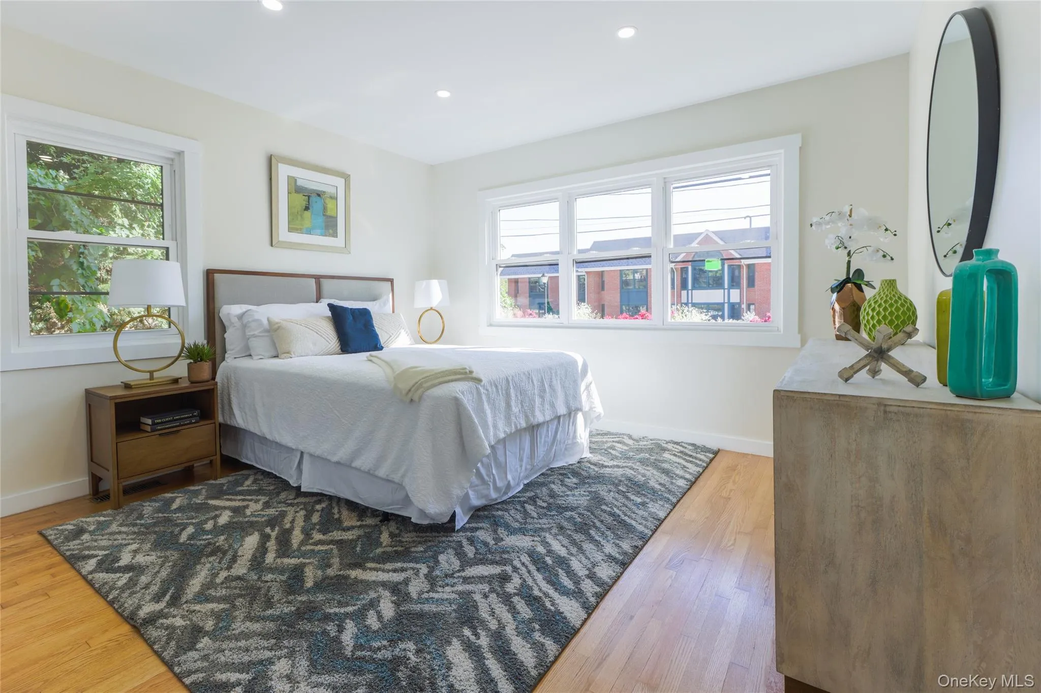 Bedroom featuring light wood-type flooring and recessed lighting Bedroom featuring light wood-type flooring and recessed lighting