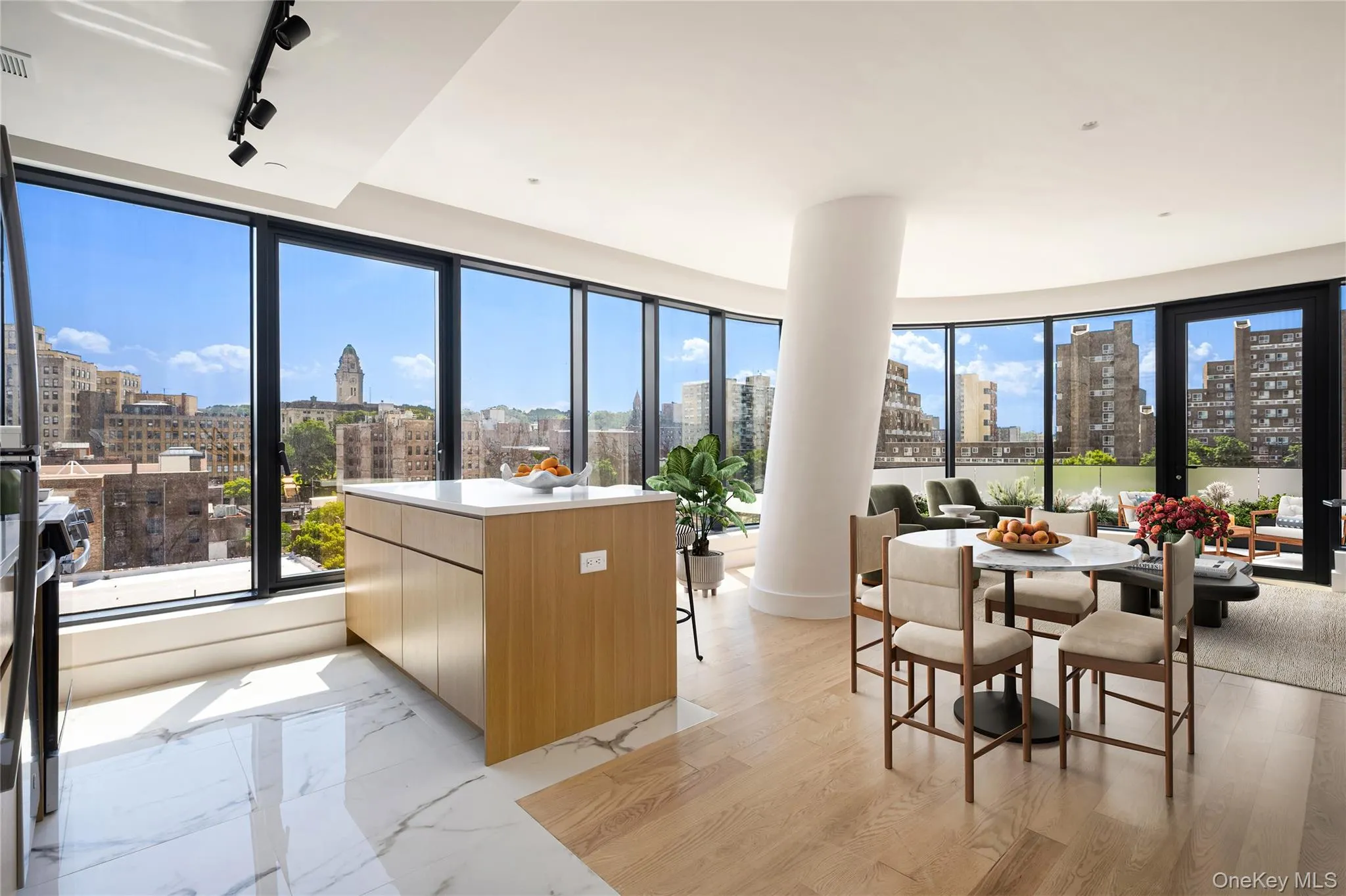 Dining space featuring a skyline view, rail lighting, and light marble finish flooring Dining space featuring a skyline view, rail lighting, and light marble finish flooring