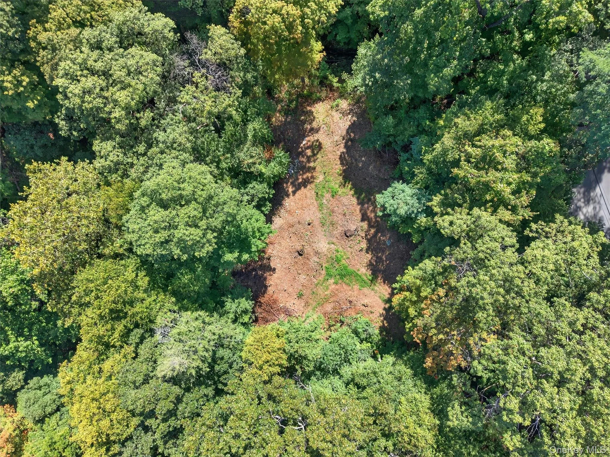 Aerial overview of property's location with a heavily wooded area Aerial overview of property's location with a heavily wooded area