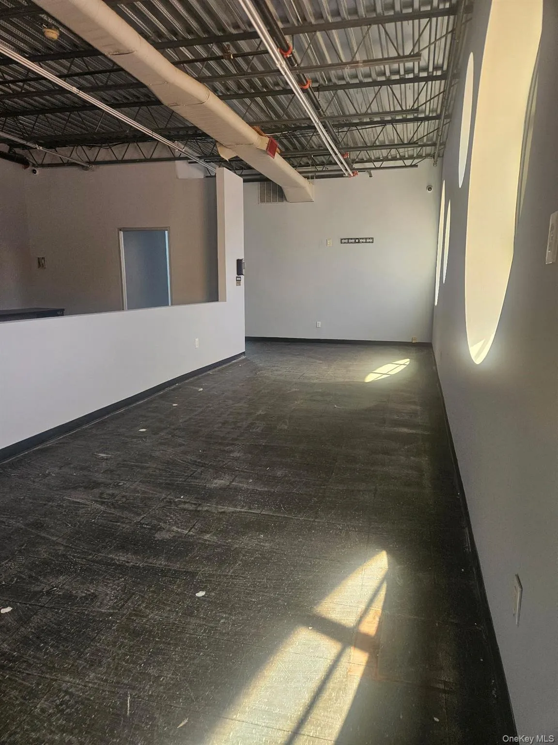 Garage featuring baseboards Garage featuring baseboards