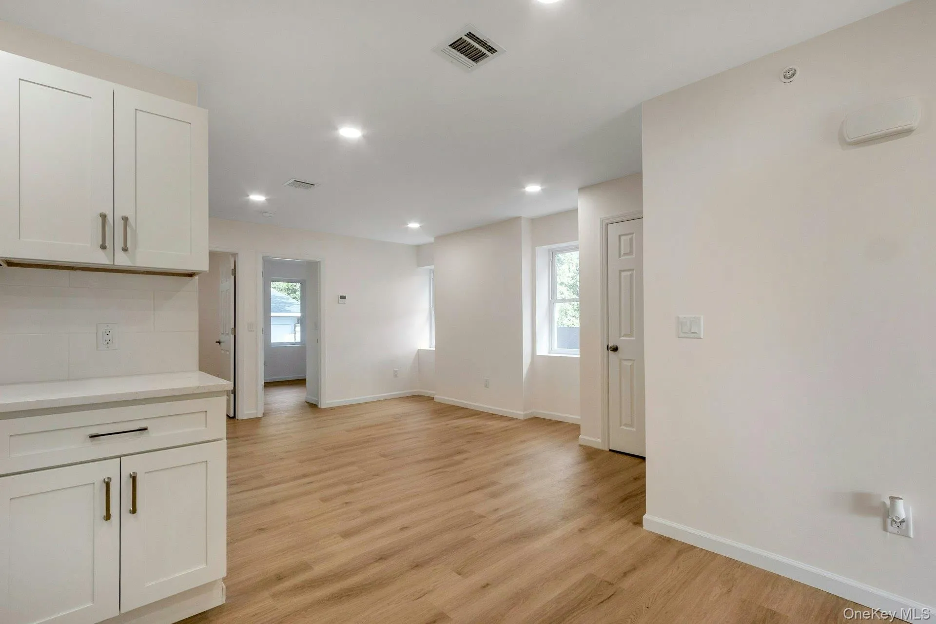 Unfurnished dining area with plenty of natural light, light wood-style floors, and recessed lighting Unfurnished dining area with plenty of natural light, light wood-style floors, and recessed lighting