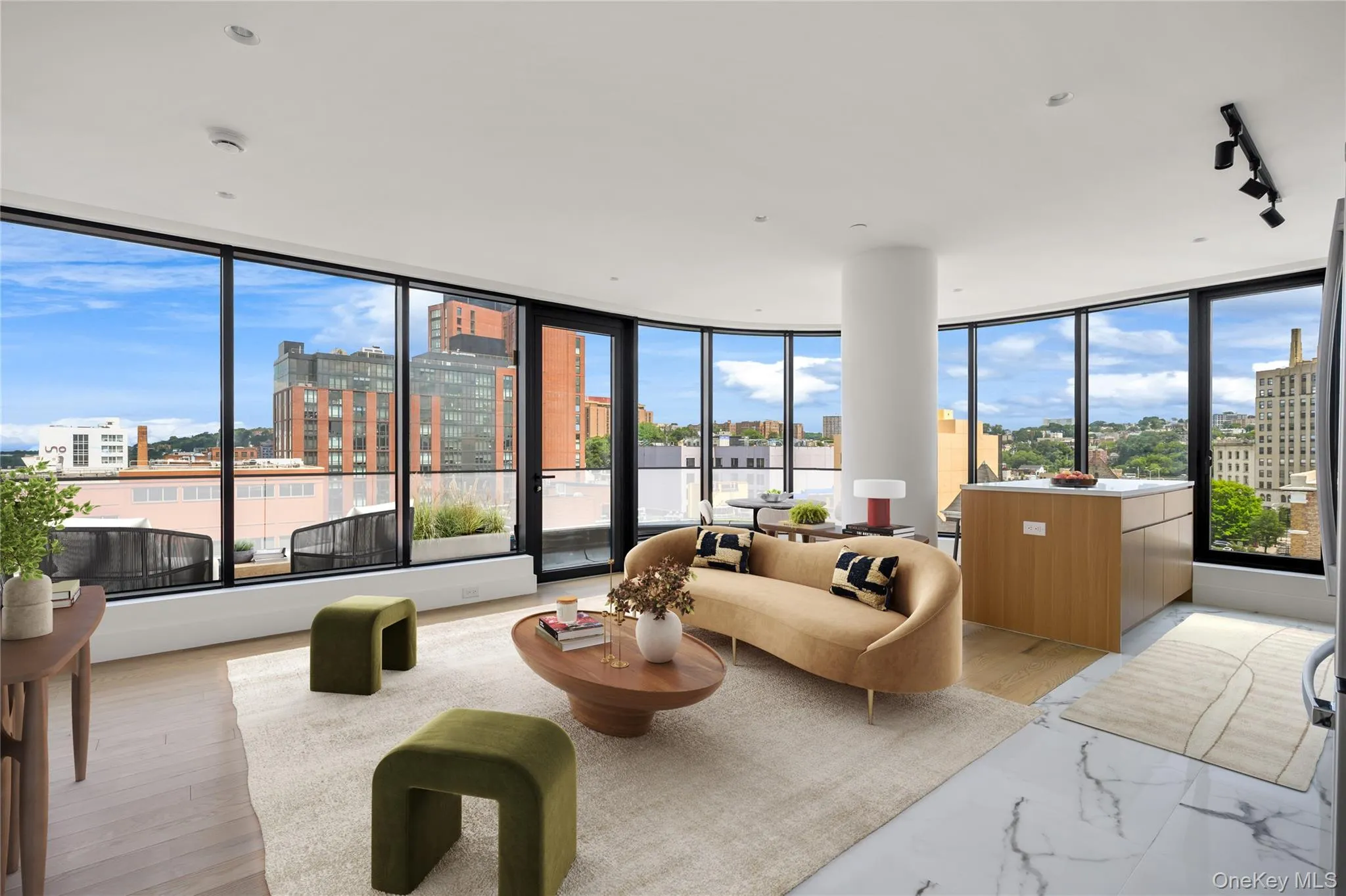Living area with a view of city, a wall of windows, track lighting, and light wood-style flooring Living area with a view of city, a wall of windows, track lighting, and light wood-style flooring