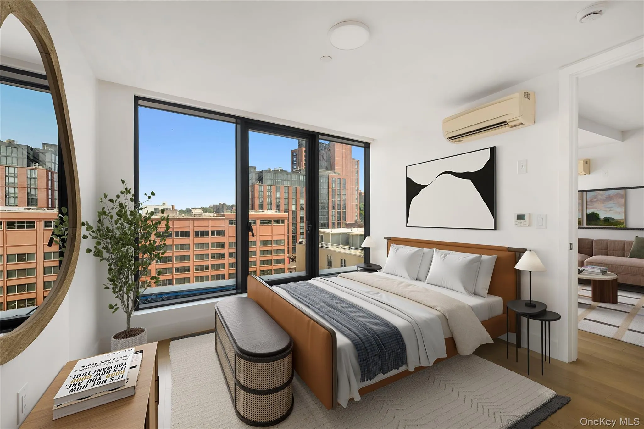 Bedroom with wood finished floors, a wall mounted AC, and a view of city Bedroom with wood finished floors, a wall mounted AC, and a view of city