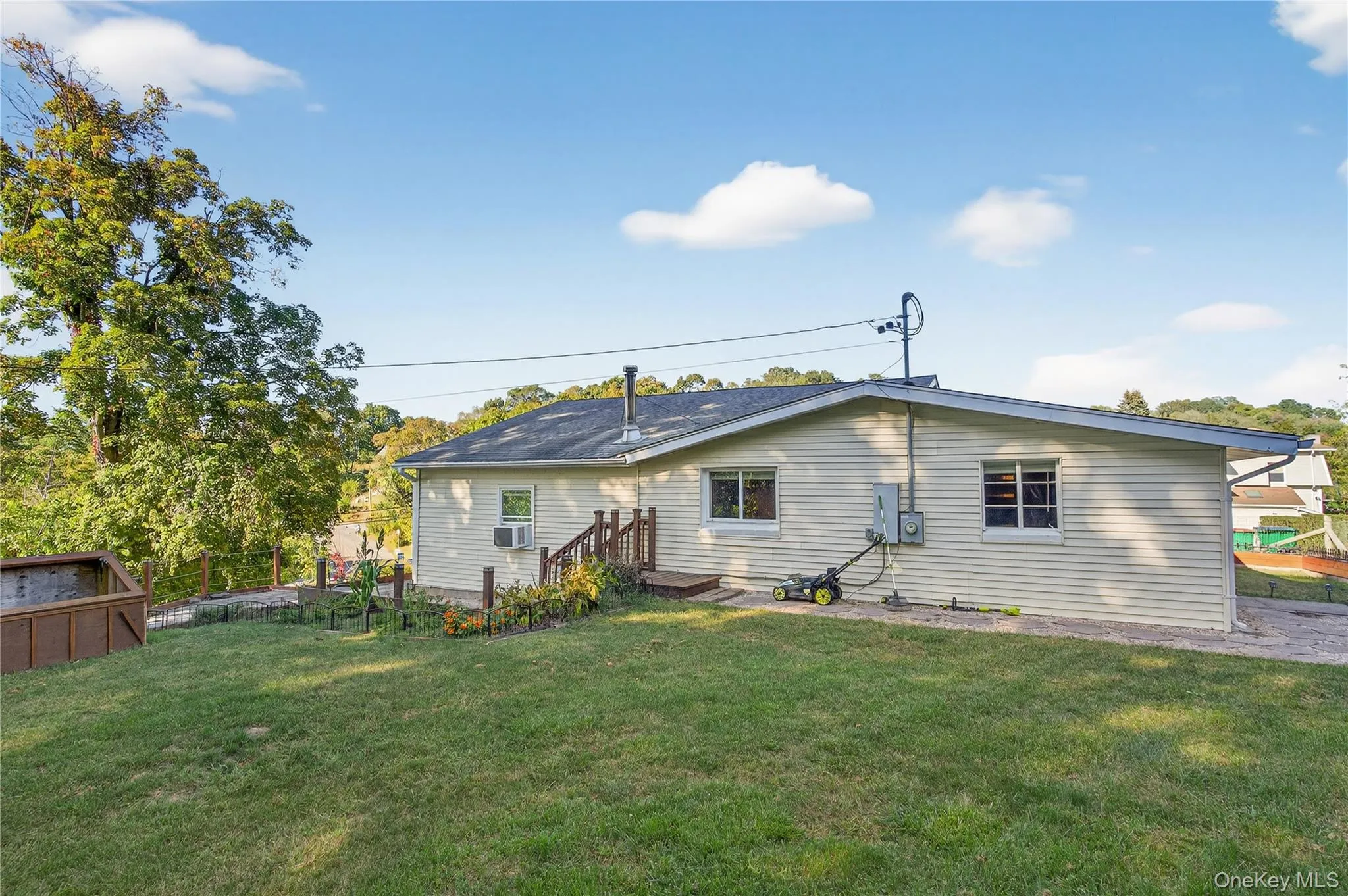 Rear view of property featuring a patio area and cooling unit Rear view of property featuring a patio area and cooling unit