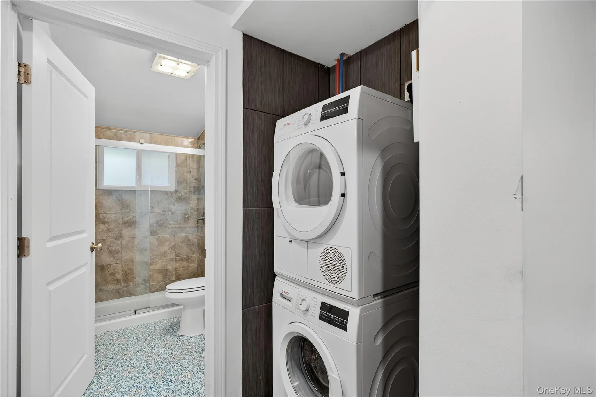 Laundry area with stacked washer / dryer Laundry area with stacked washer / dryer
