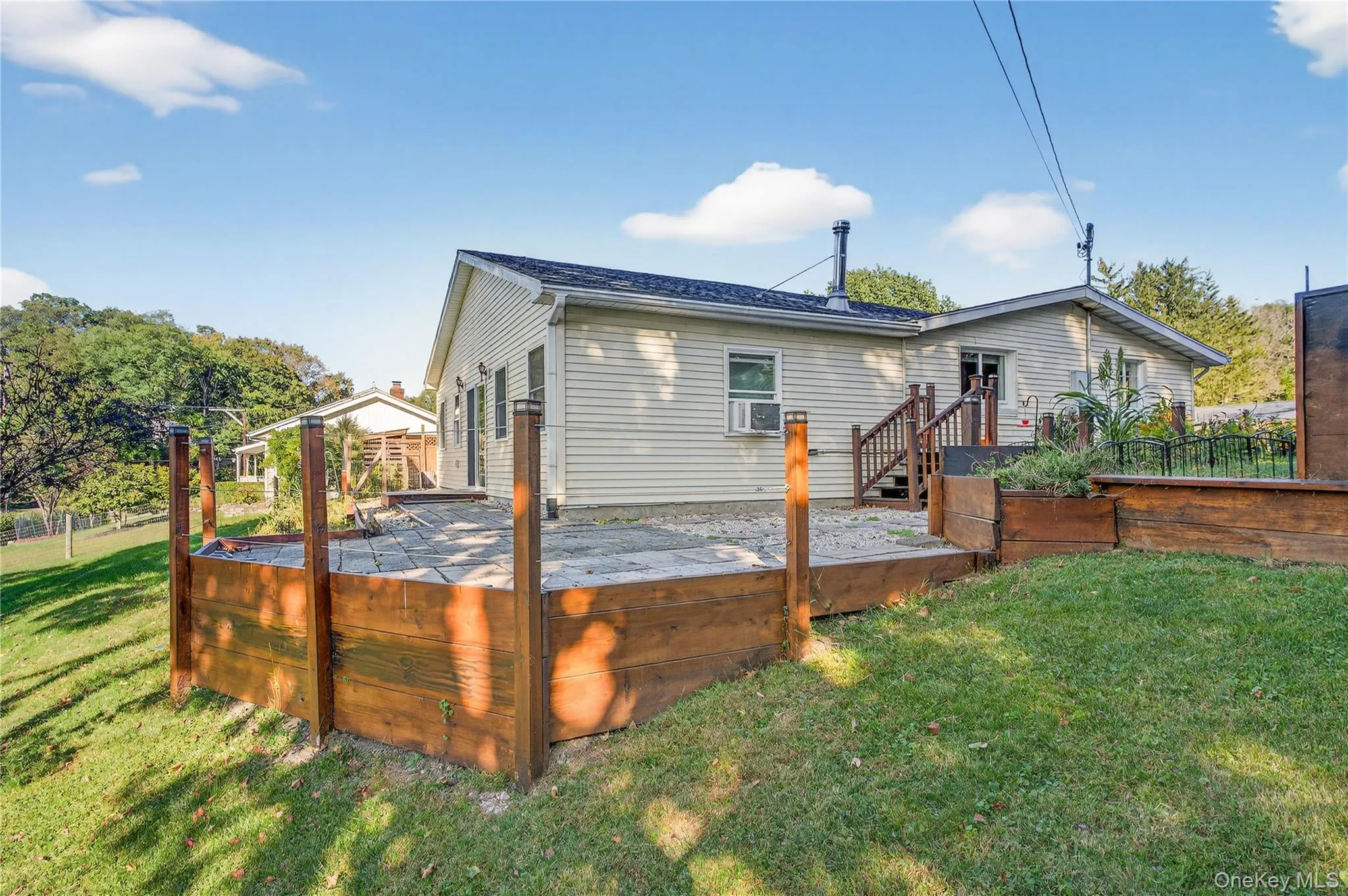 Rear view of house with a wooden deck Rear view of house with a wooden deck
