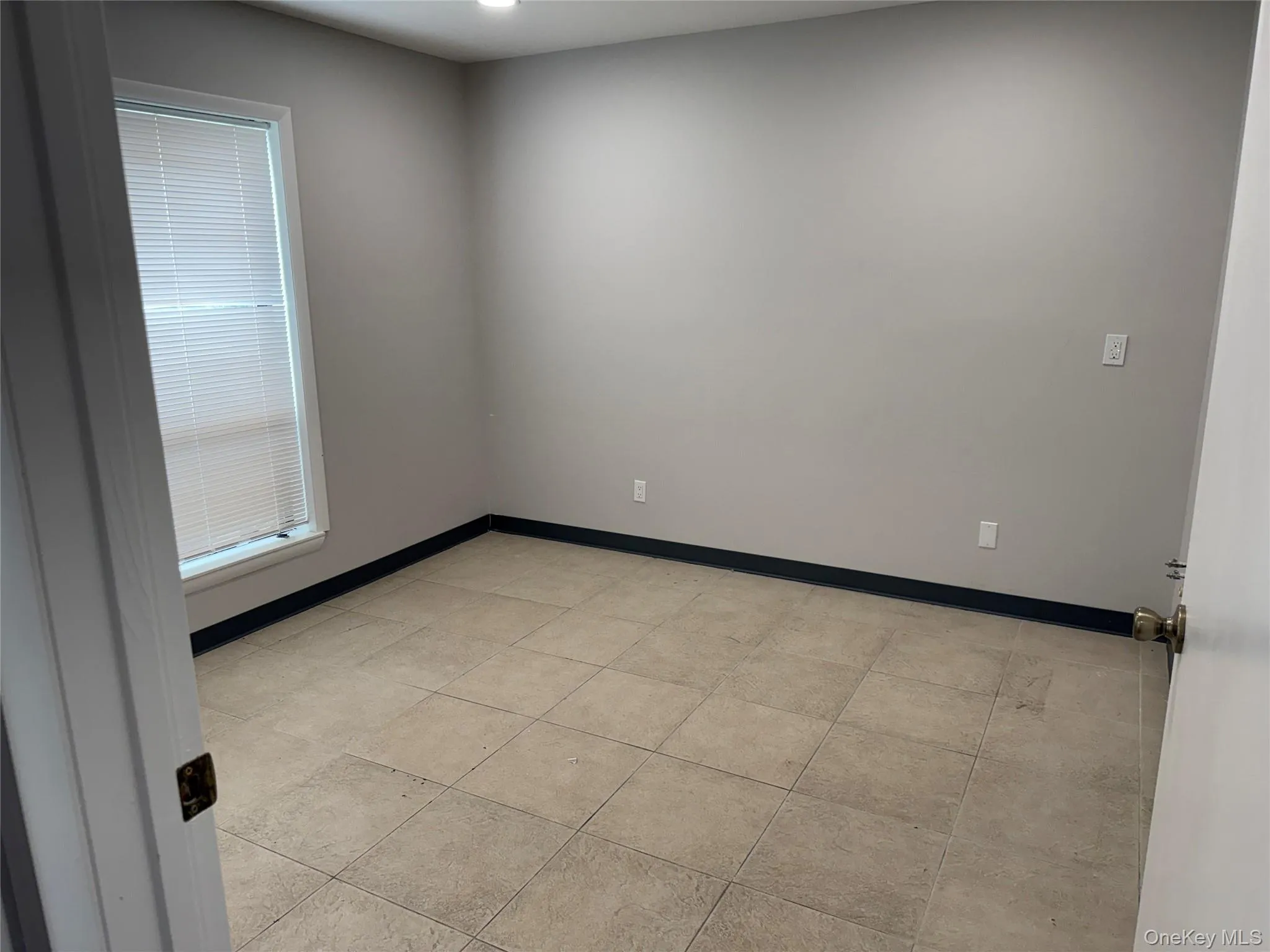 Spare room featuring baseboards and recessed lighting Spare room featuring baseboards and recessed lighting