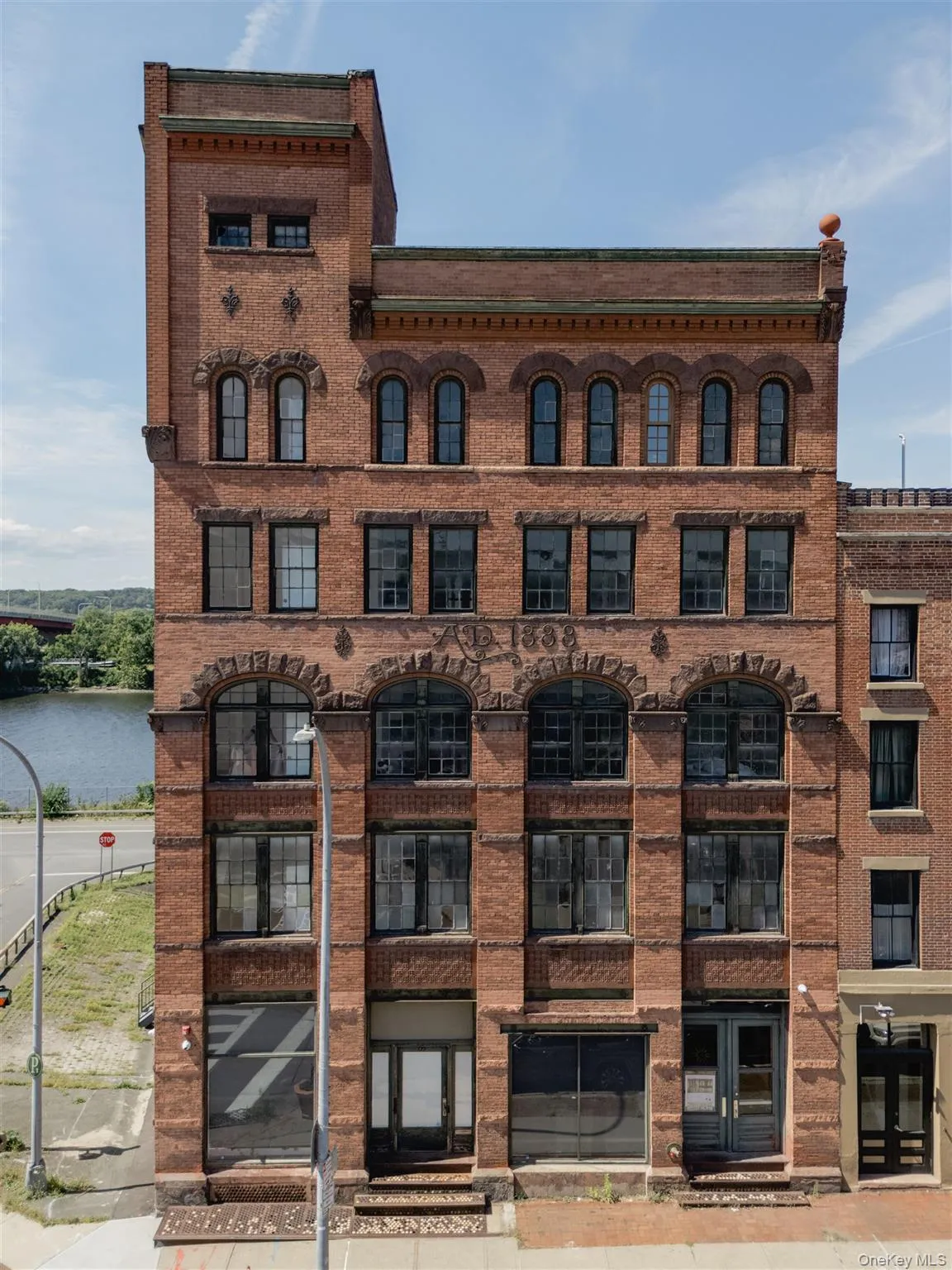 View of building exterior with a water view View of building exterior with a water view