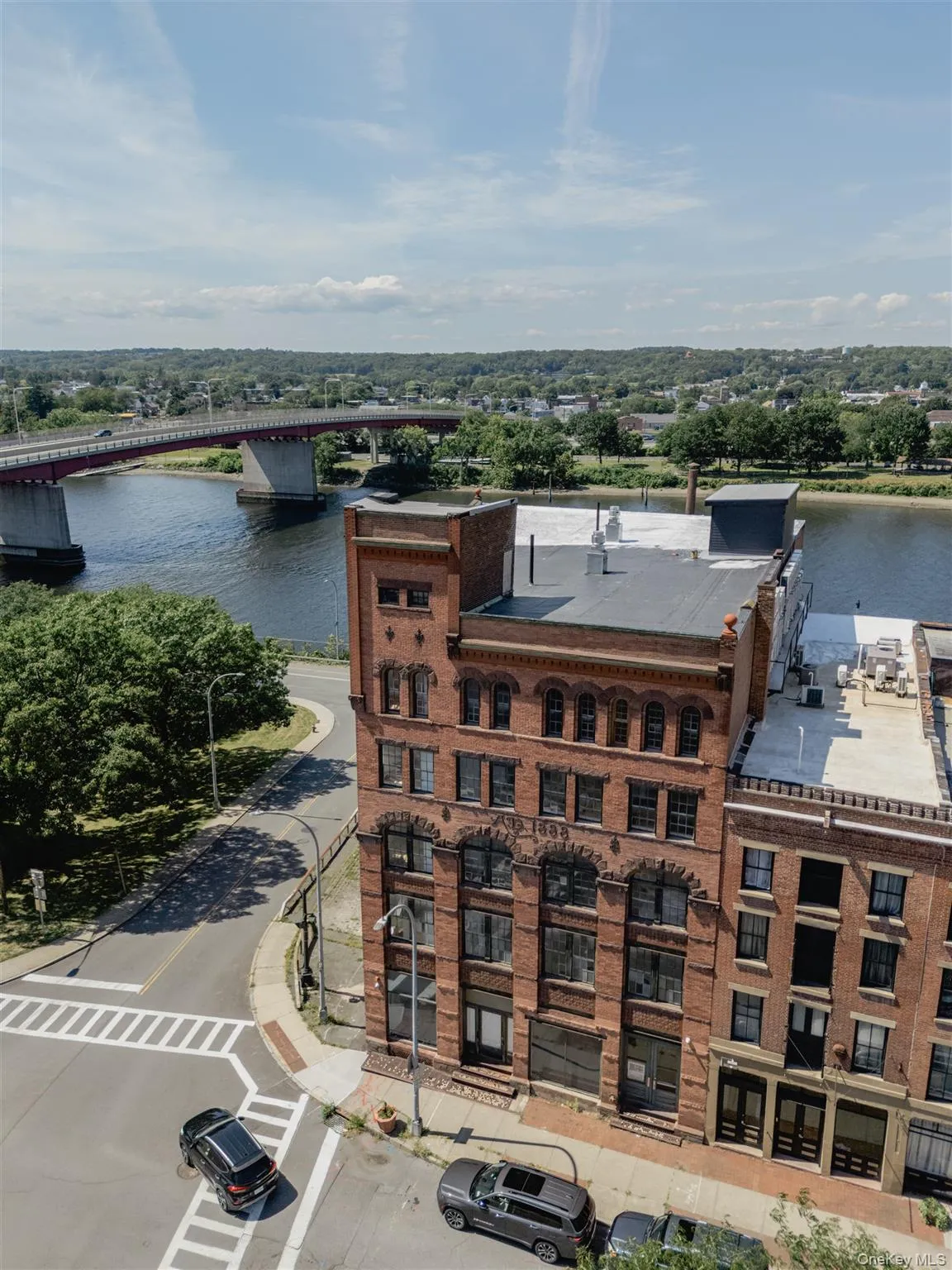 Aerial view of a large body of water and a notable bridge Aerial view of a large body of water and a notable bridge