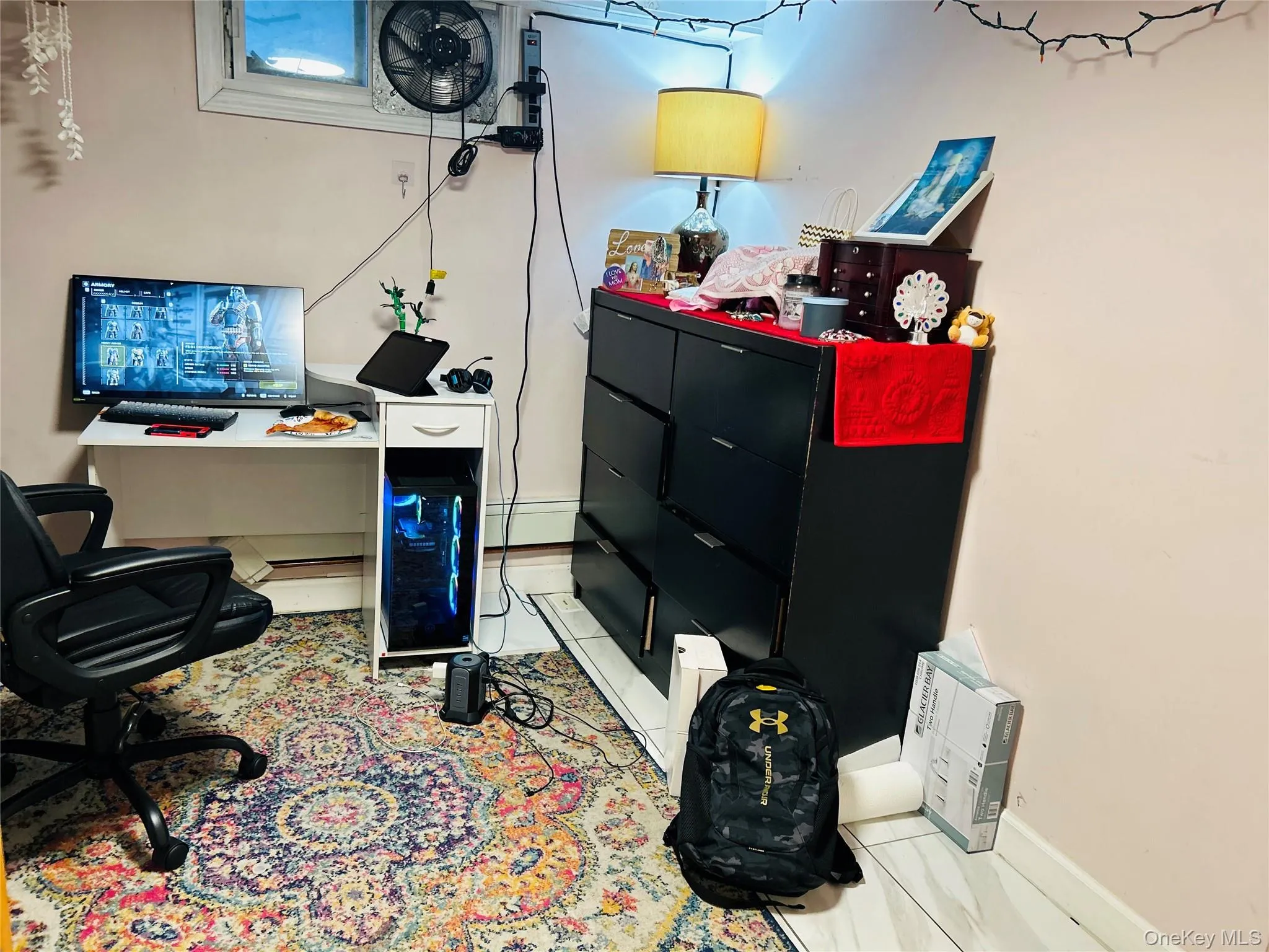 Office space featuring light tile patterned floors and baseboard heating Office space featuring light tile patterned floors and baseboard heating