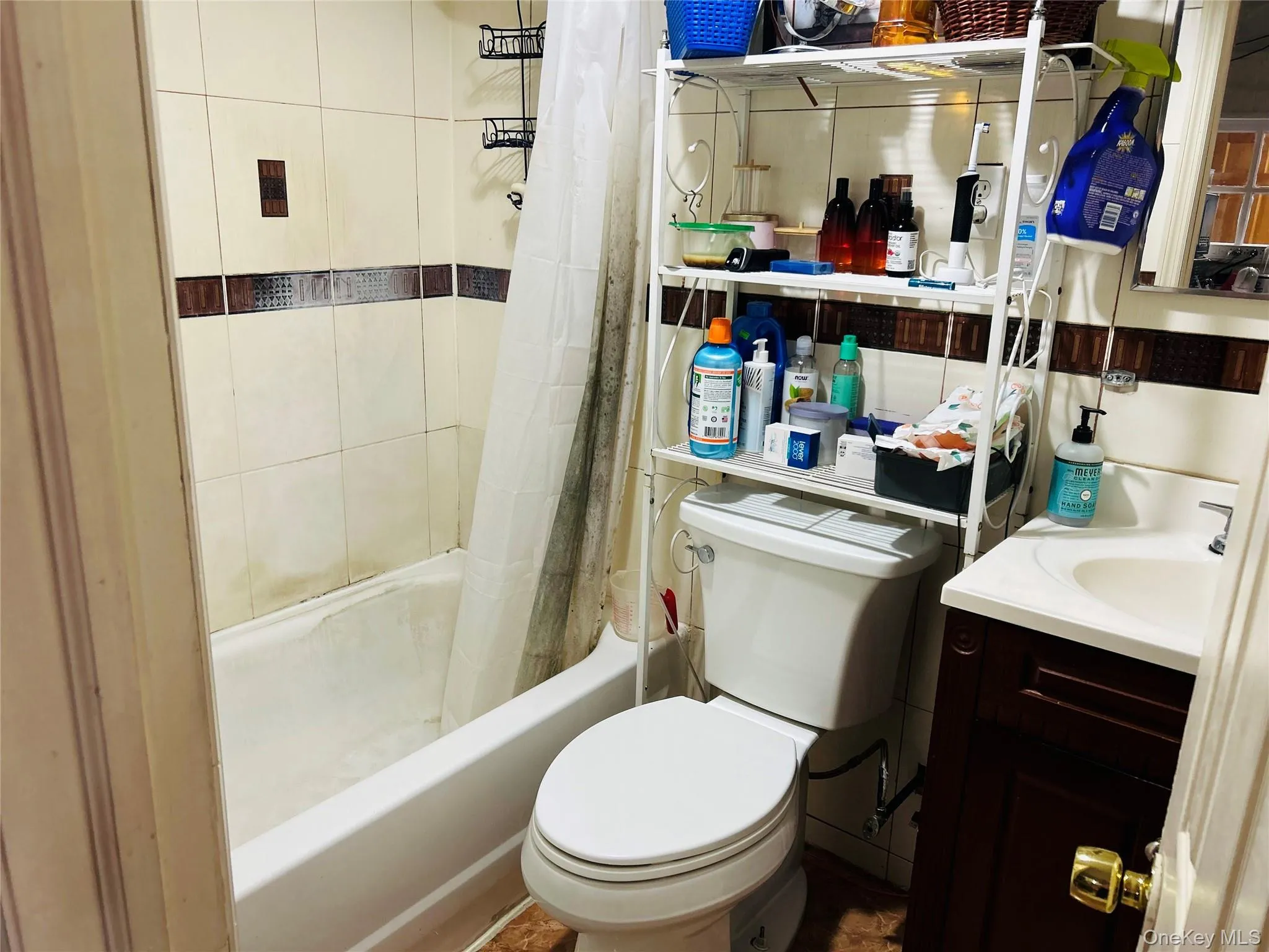 Bathroom with shower / bath combination with curtain and vanity Bathroom with shower / bath combination with curtain and vanity