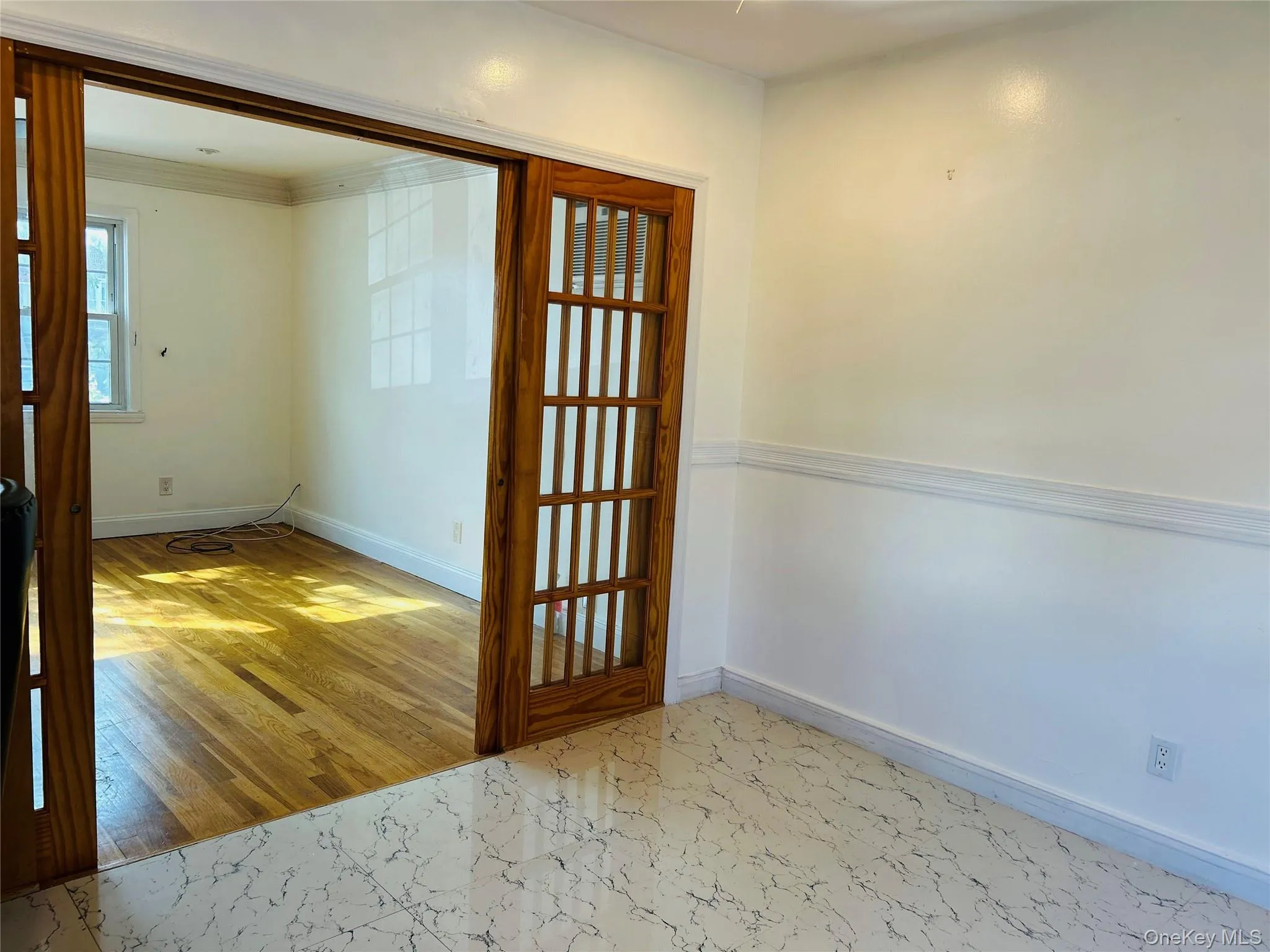 Empty room featuring baseboards and light wood-style floors Empty room featuring baseboards and light wood-style floors