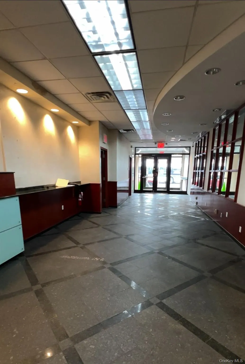 Lobby featuring a paneled ceiling Lobby featuring a paneled ceiling