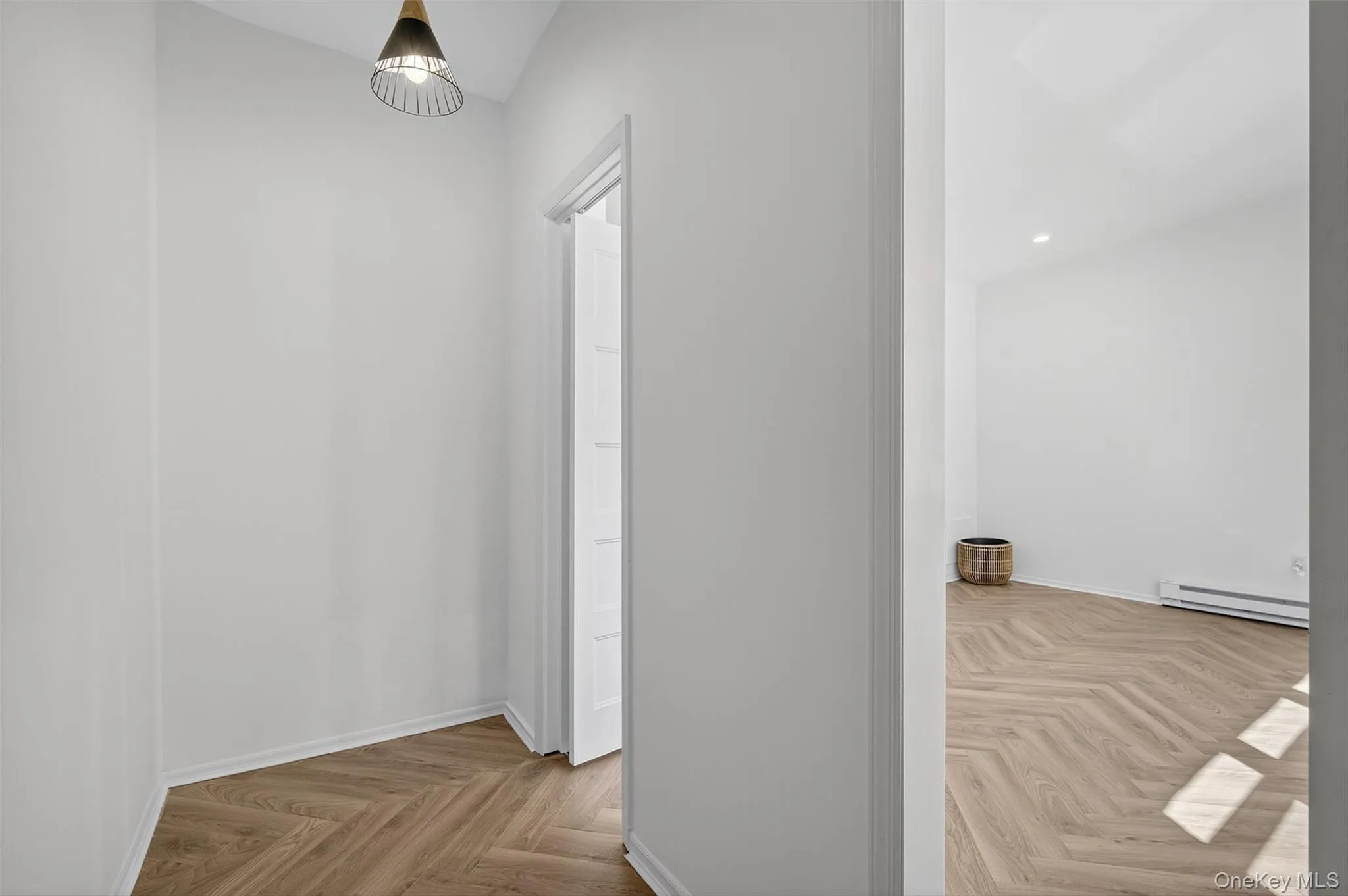 Corridor with baseboard heating and recessed lighting Corridor with baseboard heating and recessed lighting