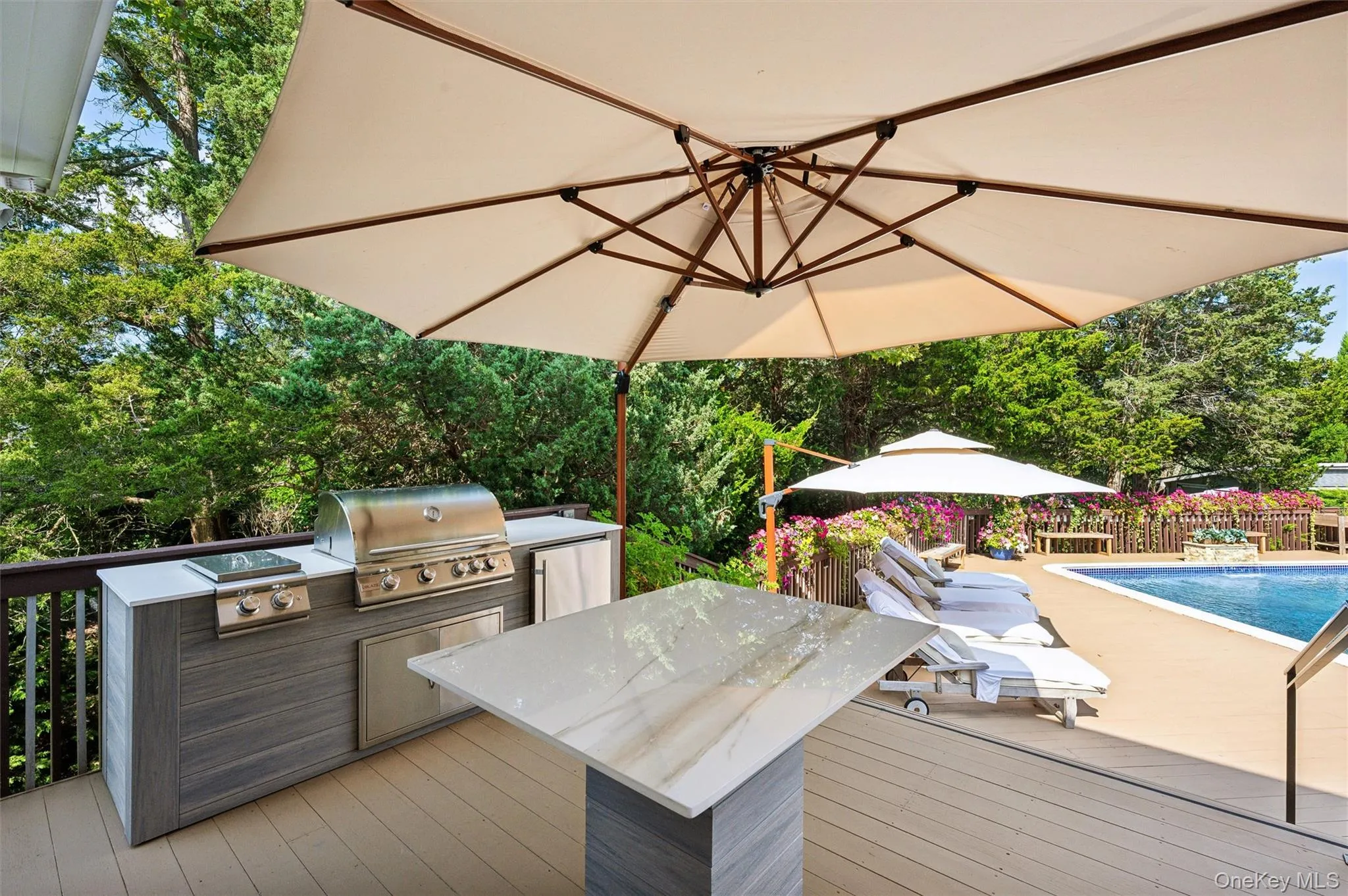 Wooden terrace with view of scattered trees and area for grilling Wooden terrace with view of scattered trees and area for grilling