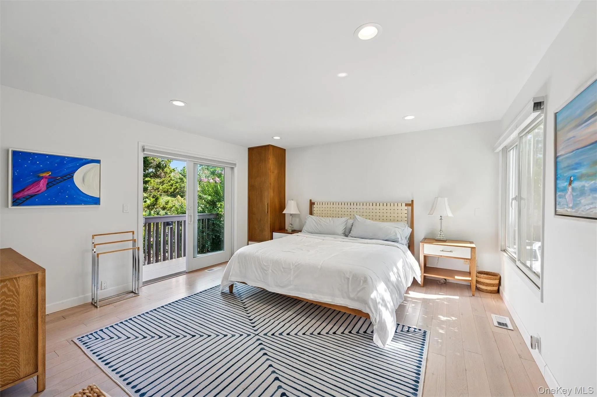 Bedroom featuring access to exterior, recessed lighting, and light wood-type flooring Bedroom featuring access to exterior, recessed lighting, and light wood-type flooring