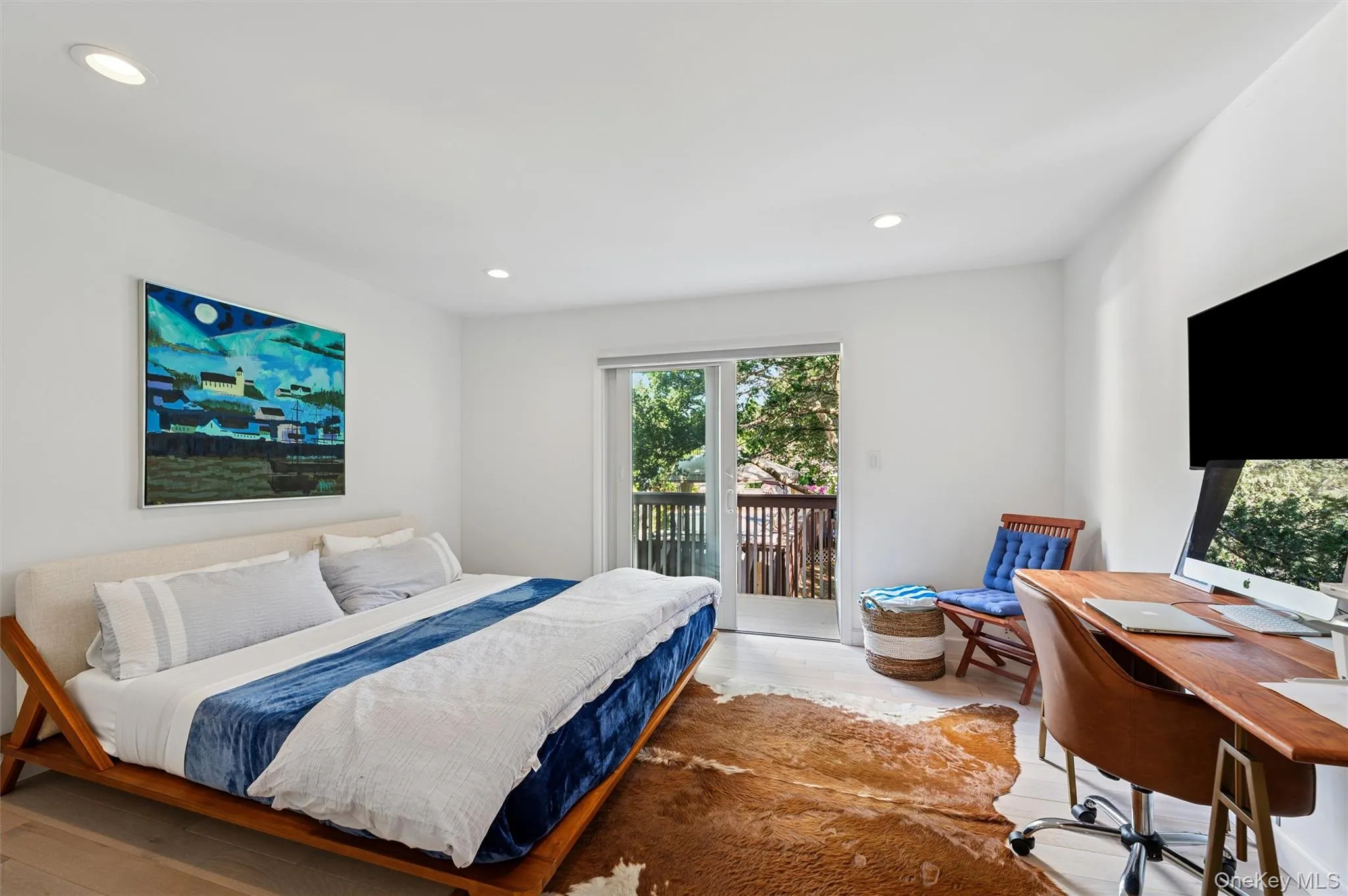 Bedroom with wood finished floors, access to exterior, recessed lighting, and an office area Bedroom with wood finished floors, access to exterior, recessed lighting, and an office area