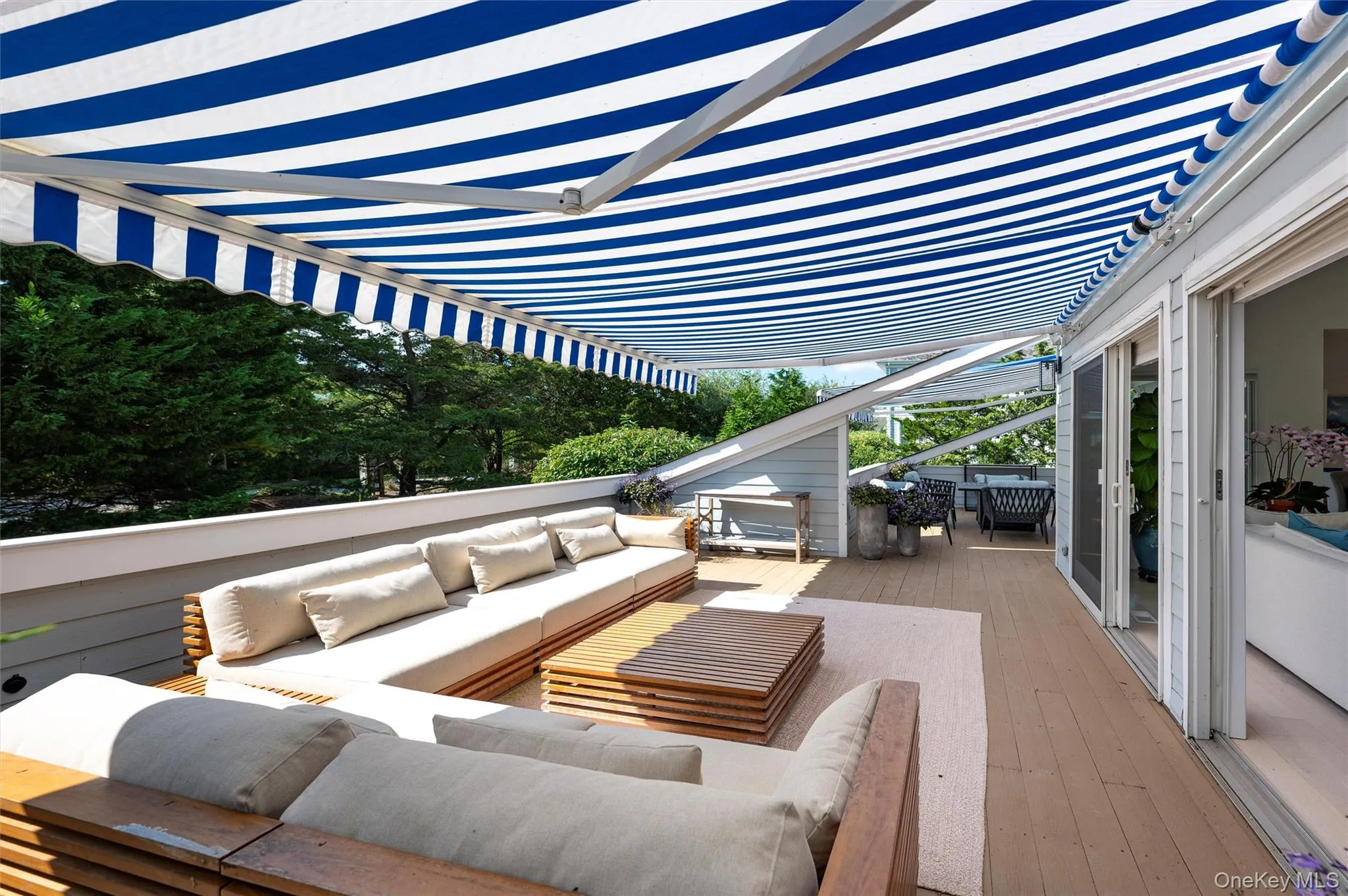 Wooden deck featuring outdoor lounge area Wooden deck featuring outdoor lounge area